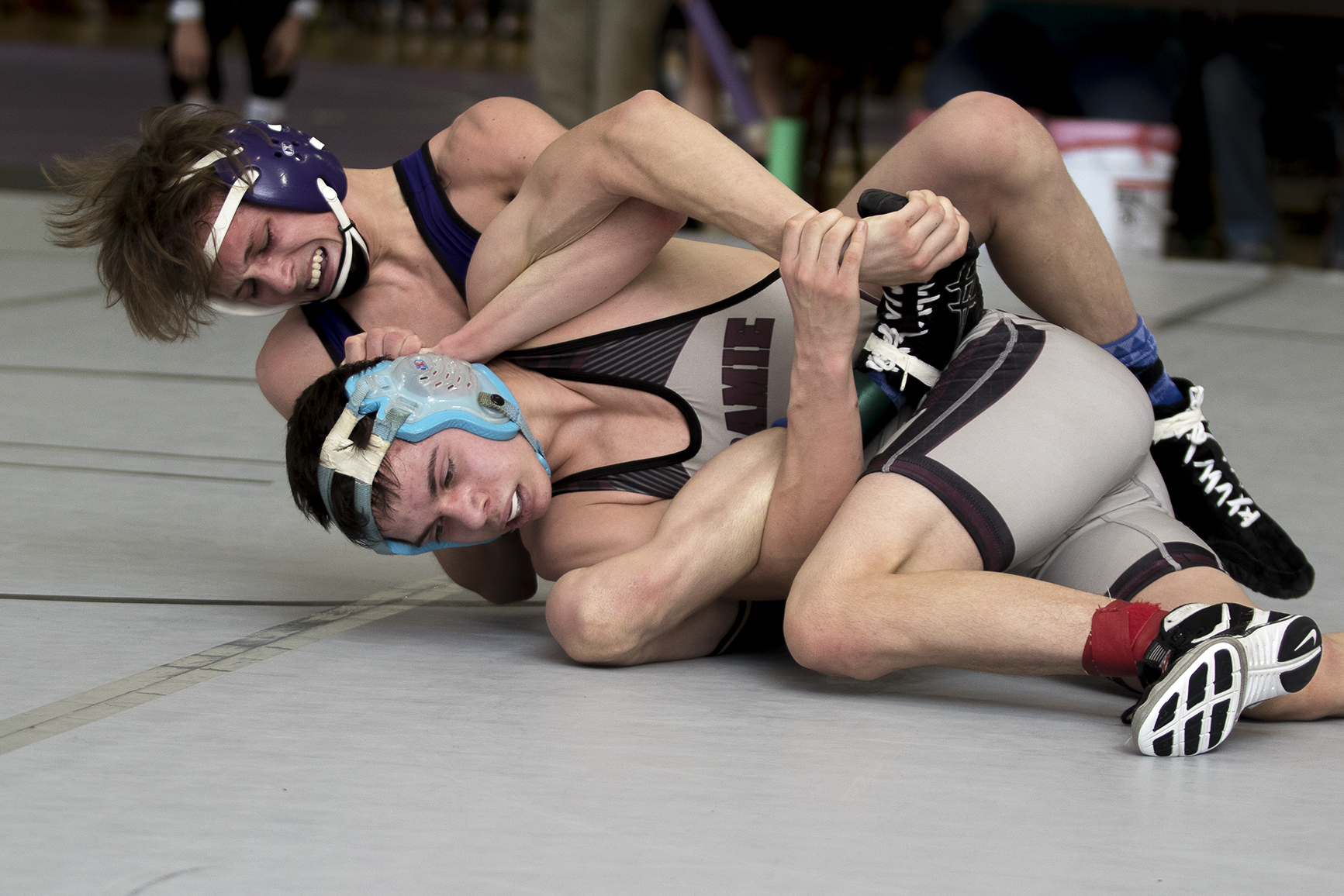 Gillette's Michael Cunningham wrestles Laramie's Arsenio Lemus in the 120-pound weight class during 4A East Regional wrestling tournament Friday as CCHS South Campus.