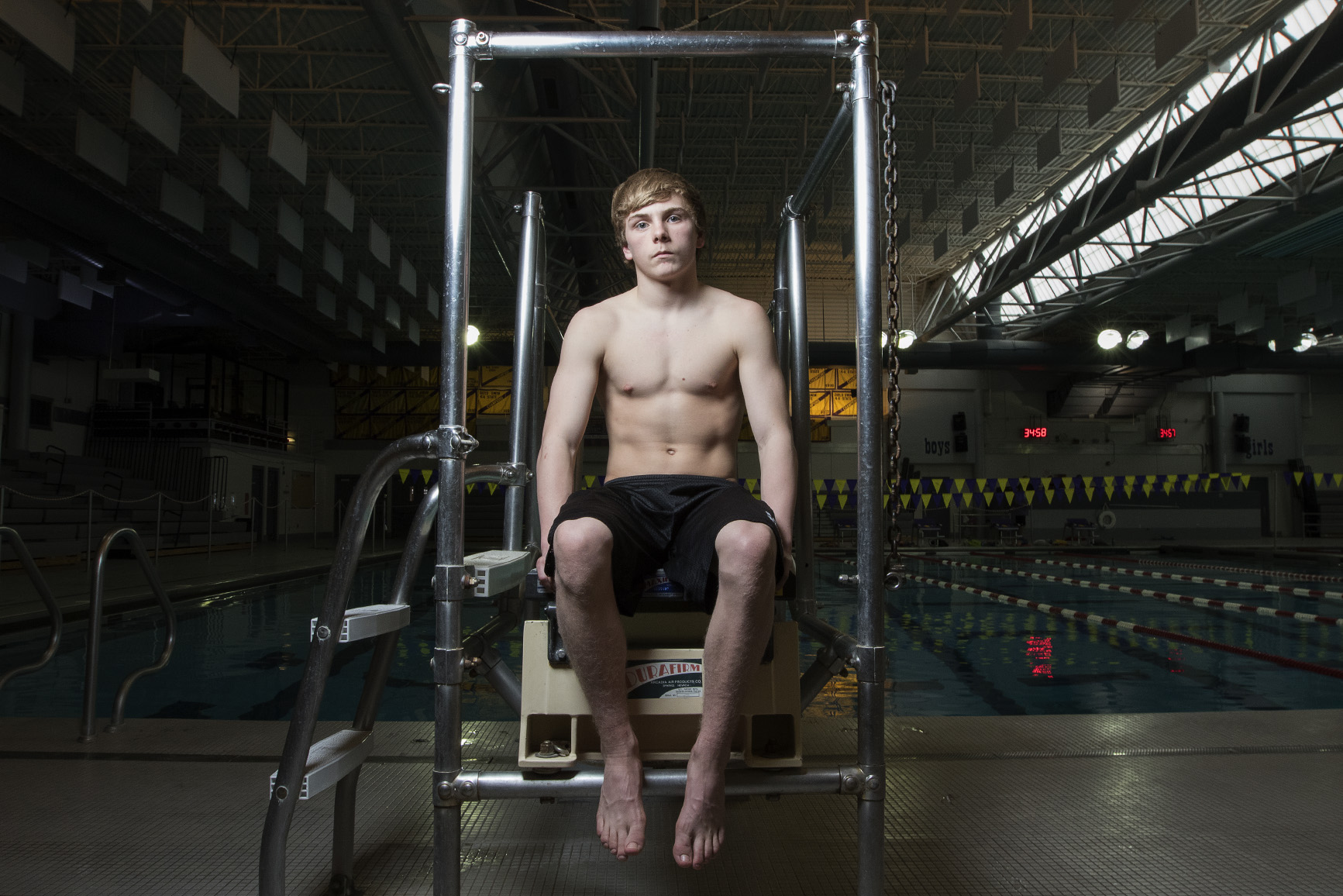 Ty Williams sits on the diving board the the Campbell County Aquatic Center Monday afternoon. At the four 11-dive meets this season Williams has outscored his closest competition by an average of 65.4 points and is the favorite to win the state diving title this Saturday.