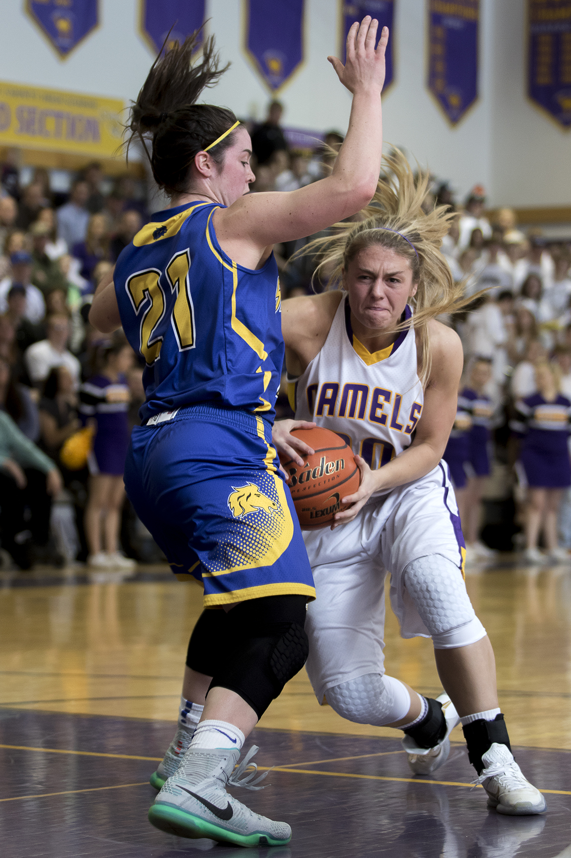 Gillette senior Jessie Geer drives past Sheridan's Robbie Ryan Friday night during the Camel's 63-51 win over the Broncs at CCHS North Campus.