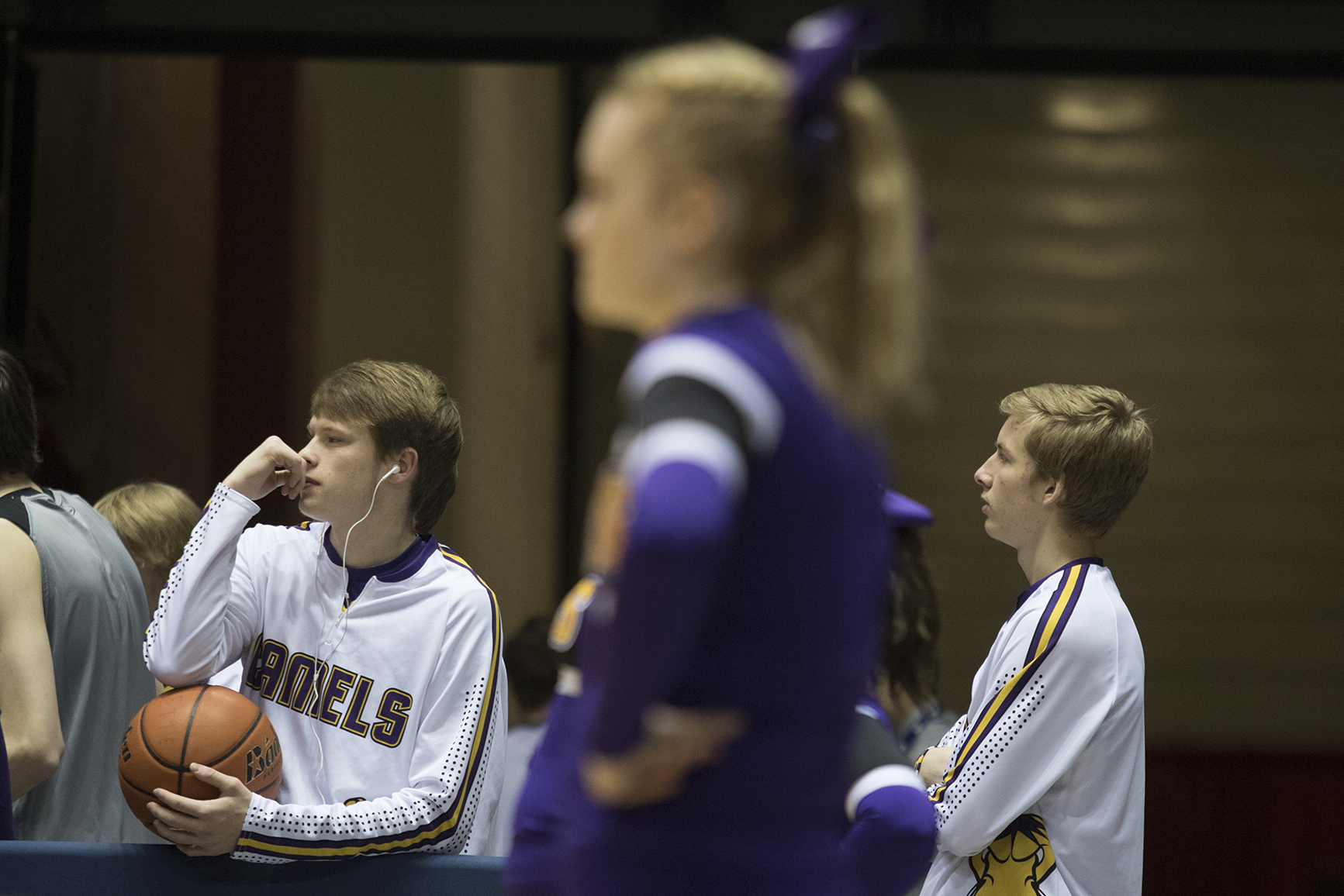 Gillette senior Dalton Holst, left, watches the Camel girls play in the semifinals of the girls 3A state basketball tournament Friday night at the Casper Event Center. Gillette beat Cheyenne East 58-46 and will play Natrona for the title Saturday evening.