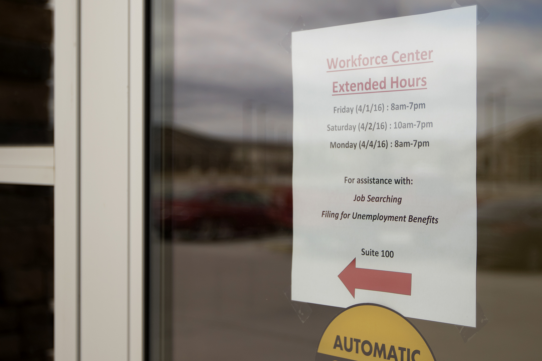 A note on the door of Wyoming Department of Workforce Services alerts clients to the office's extended hours on Friday April 1, 2016. After more than 450 local mine workers were laid off, state and local agencies worked extra to get them help, including setting up a temporary resource center at Gillette College.
