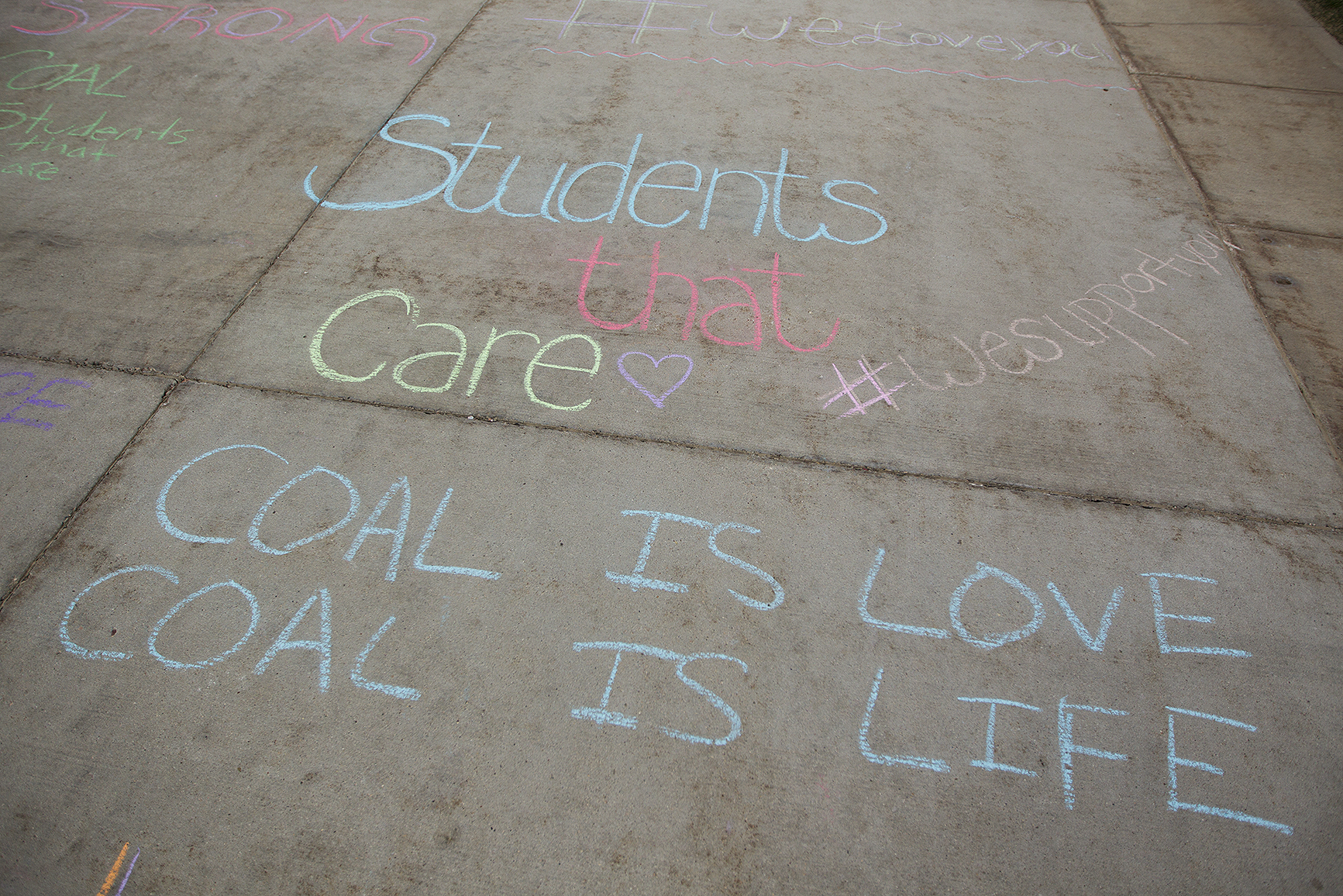Supportive messages are written in chalk outside the Heritage Center before the Friends of Coal town hall meeting on Thursday April 14, 2016. Members of Friends of Coal, as well as miners and other coal industry representatives came to Gillette to speak about how to strengthen the perceptions around coal.