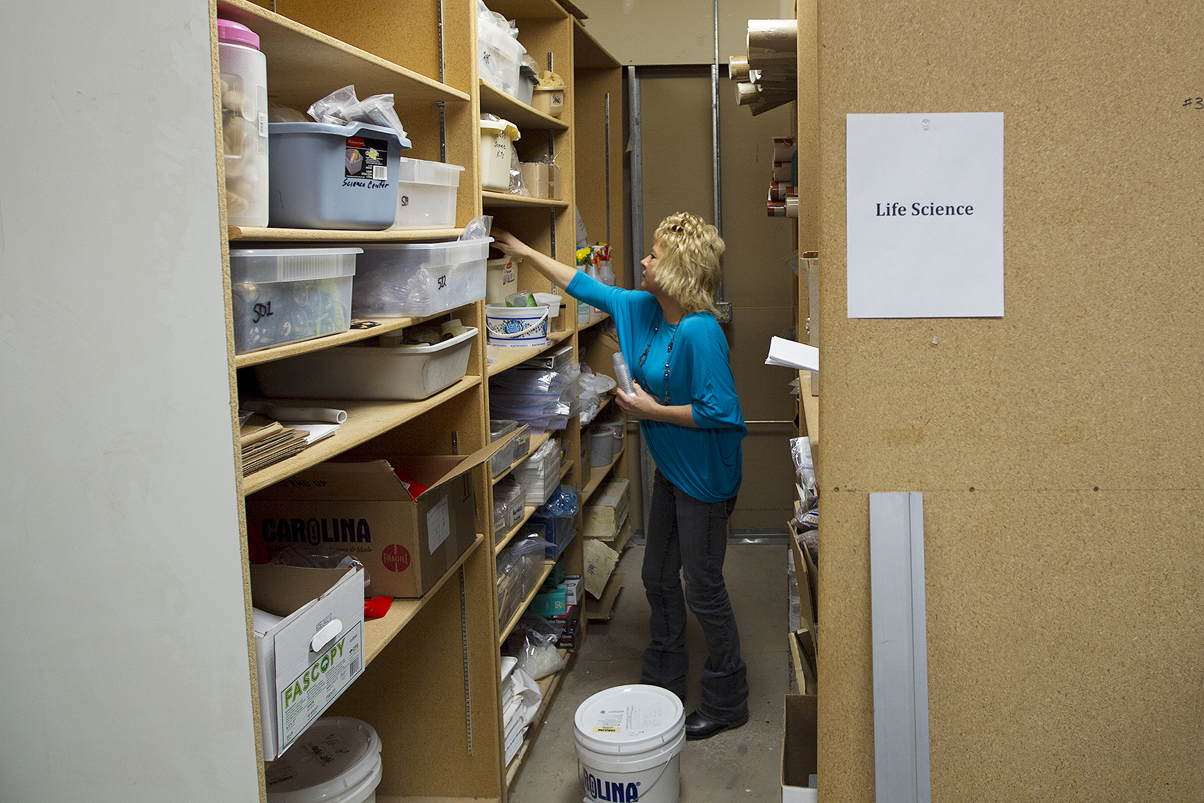 Science Center Technician Candy Morgan collects materials Friday morning for a science kit that she's prepping for next fall. Once the kits get used and returned, Morgan goes through them and refills any materials that are needed, and repairs anything that's broken or worn out. "A lot of the new ones, we test them and make sure that they work," before sending them out to the classrooms she said.