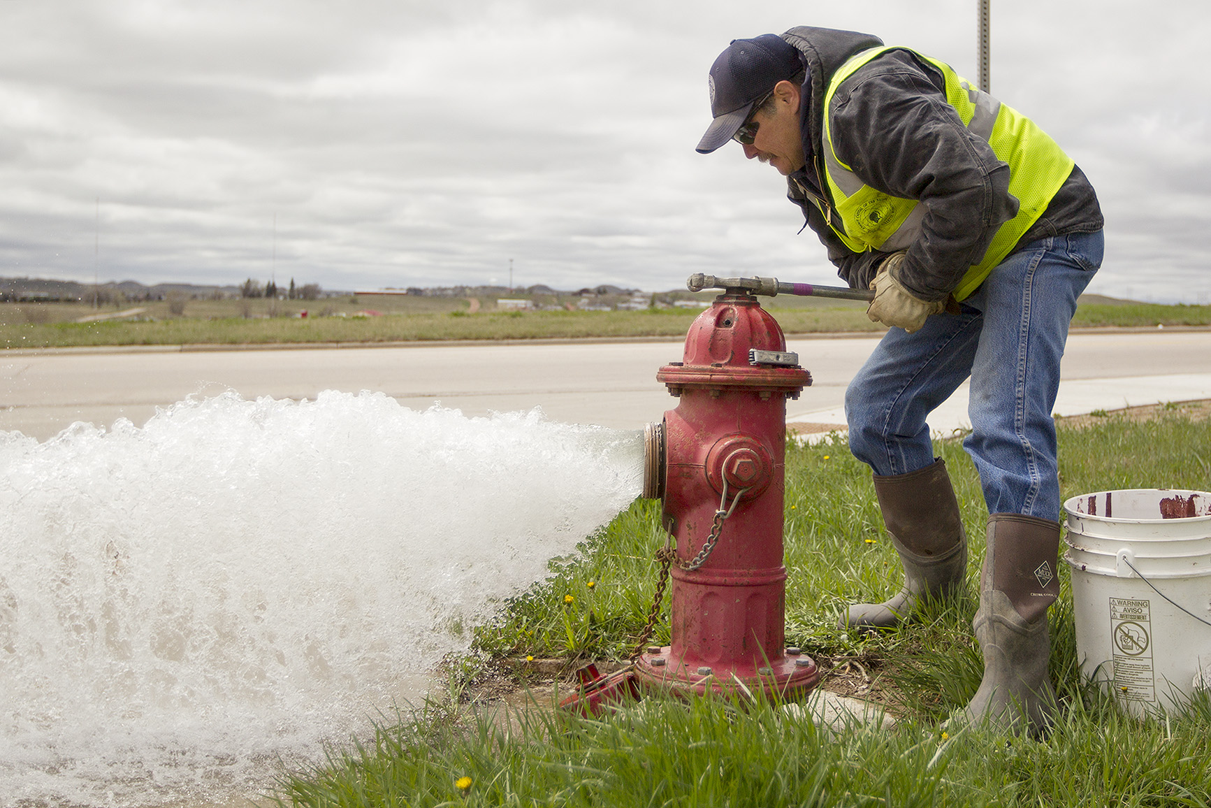 Scott Sorenson, foreman for the Gillette water division, opens a fire hydrant on Gurley Avenue Monday afternoon as the city crews begin flushing the city's water lines. The annual flushing of the water lines clears any sediment and debris that has settled in the pipes, and allows crews to check on water pressure and make sure the hydrants are working properly.