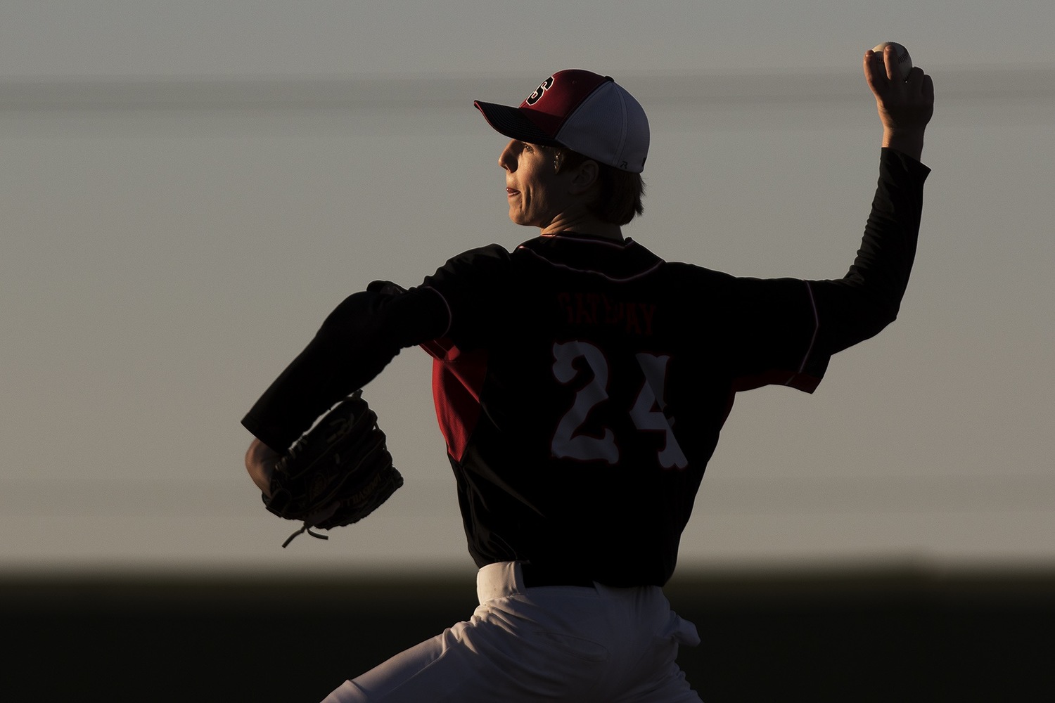 Sturgis Scoopers pitcher Caleb Bates throws a pitch to the Gillette Roughriders Thursday night during the Riders 7-0 season opener at Hladky Memorial Stadium.