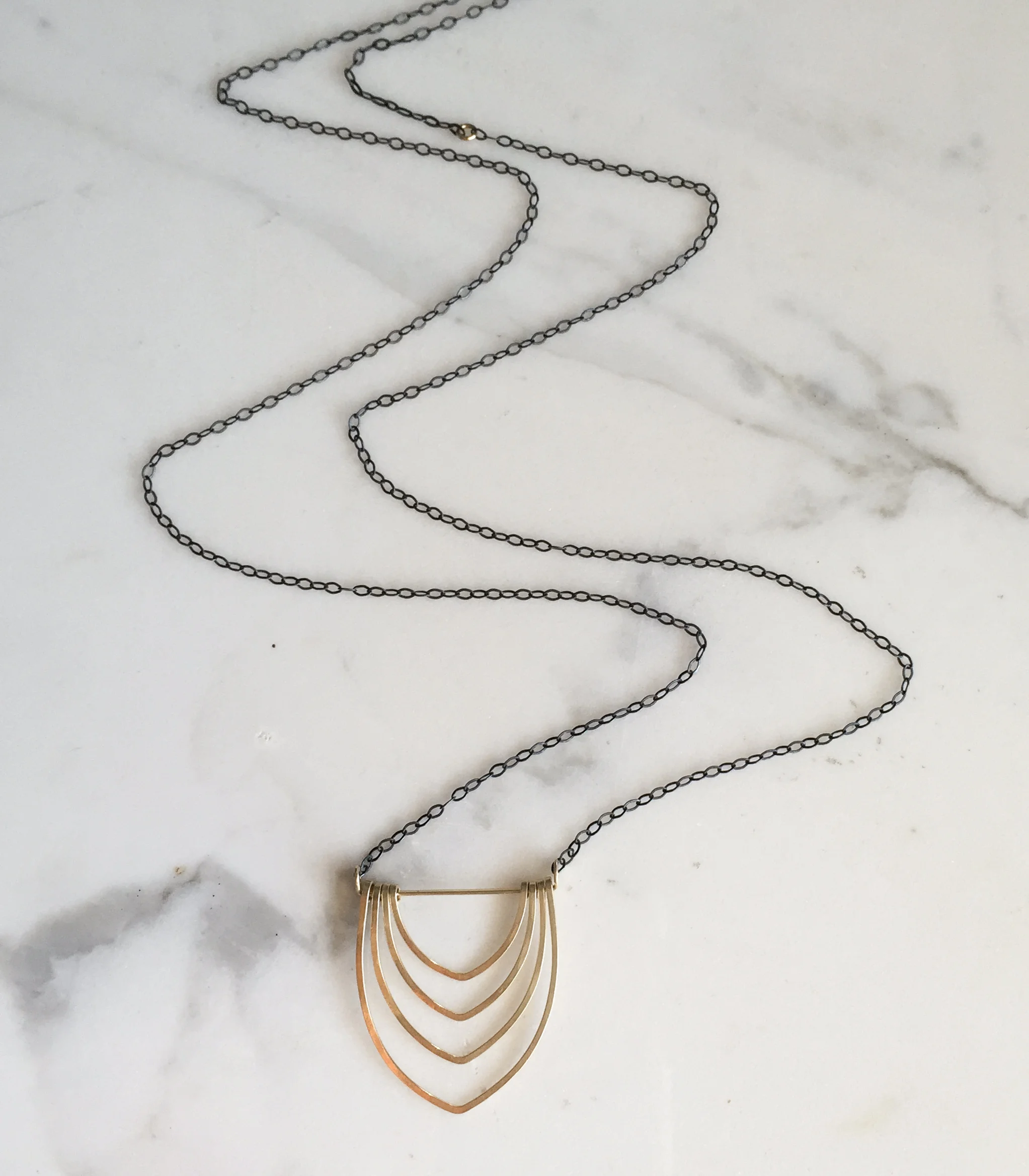 long gold layered arch necklace