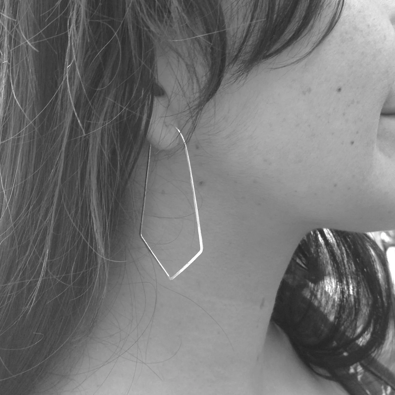 long hammered geometric hoops silver