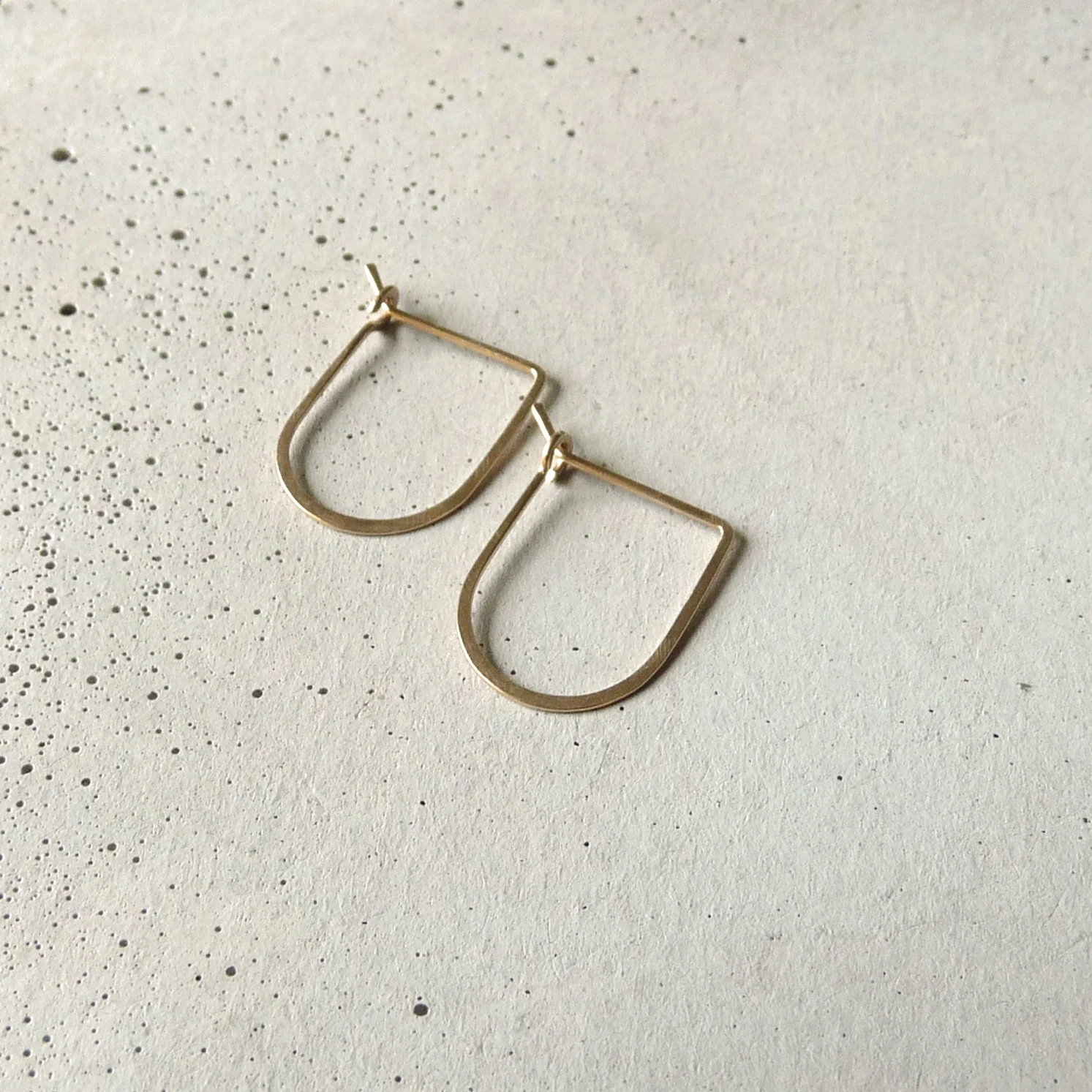 geometric gold arch hoop earrings