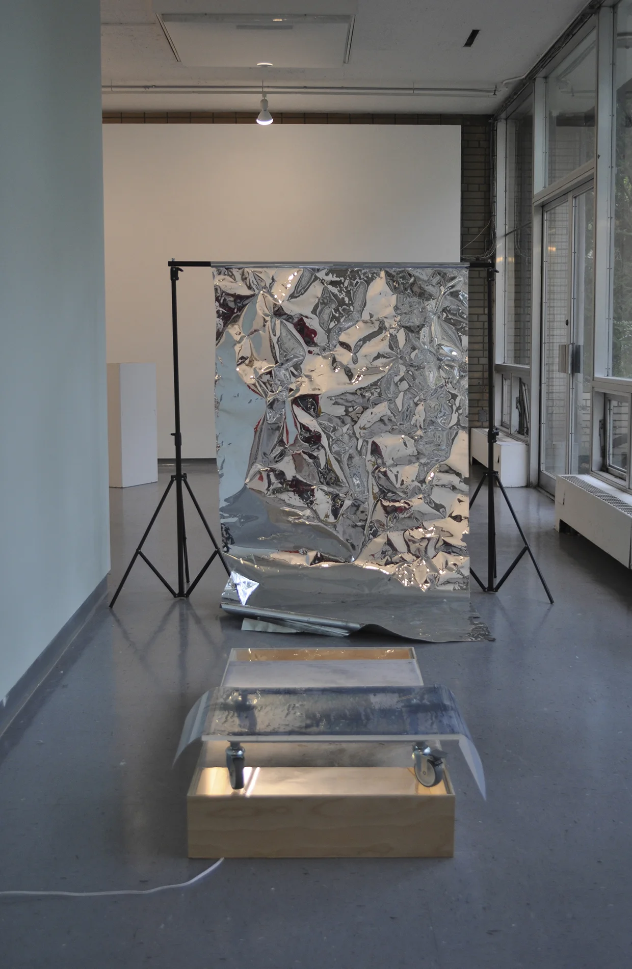 mobile flood ,48 x 24 in, mylar, fluorescent light, birch plywood, plexiglass, cotton digital print, casters, acetate digital print, photography backdrop, 2014 