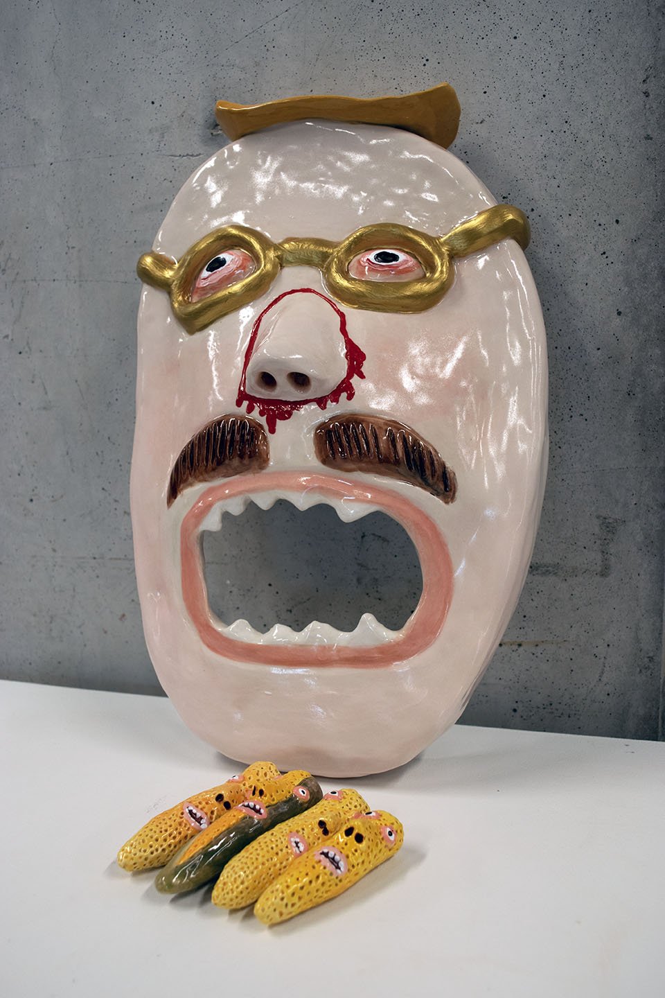 02_JACOBRHODES_BRIAN'SCORNHOLEGAME_CERAMICANDENAMEL_14X9X4_2023_LAURENCOHEN.jpg