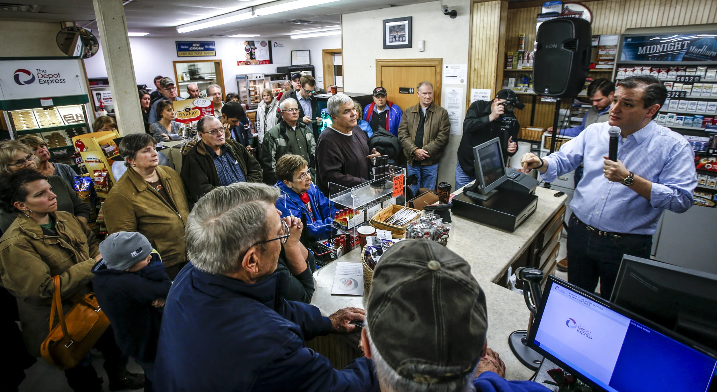 Sen. Ted Cruz speaks to a crowd packed in the Depot Express gas station in Van Horne, Iowa, Sunday, Nov. 29, 2015. The presidential hopeful made a stop at the Depot Express gas station to give a speech and answer questions with gathered community members and supporters.
