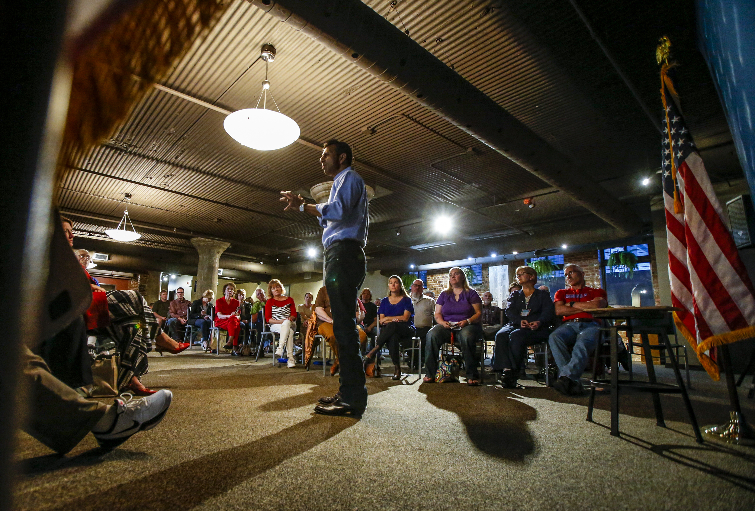 Presidential hopeful Bobby Jindal engages with members of the audience at the Shores Event Center in Cedar Rapids, Iowa, October 1, 2015. The Louisiana governor made a stop in Cedar Rapids to speak to a crowd of over 70 people and take questions from the crowd.