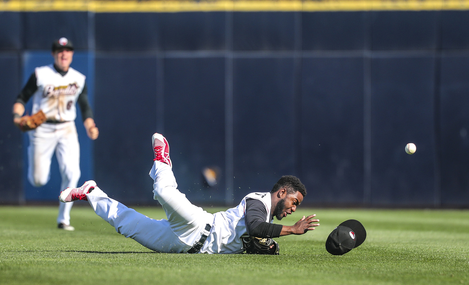 Quad-Cities River Bandits second baseman Marcos Almonte (1) loses his hold of a caught fly ball after diving and landing in the outfield during their game at Modern Woodmen Park in Davenport, Iowa, on Sunday, April 29, 2018. 