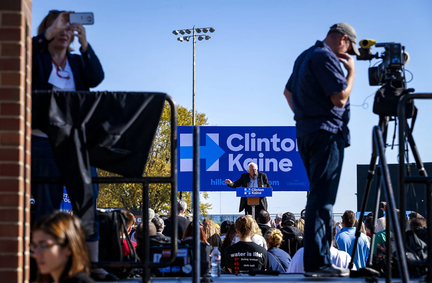 Sen. Bernie Sanders is seen speaking from behind a press riser outside Modern Woodmen Park in Davenport, Friday, November 4, 2016. The Hillary Clinton campaign held the Davenport, Iowa, Stronger Together Rally with Senator Bernie Sanders to encourage Iowans to vote early and support Clinton.