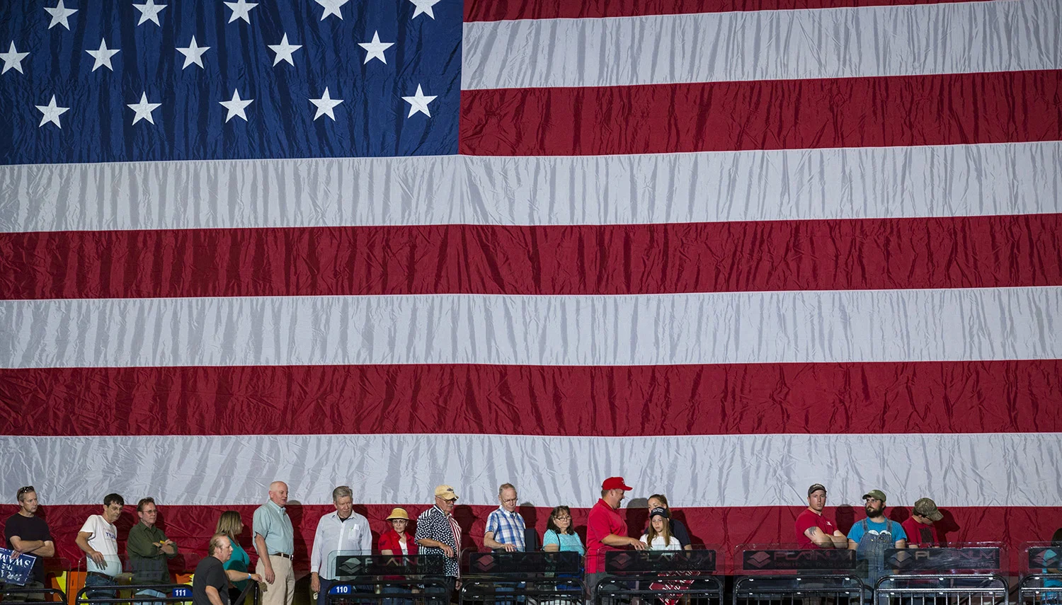 Supporters file in to hear President Donald Trump speak at the U.S. Cellular Center in Cedar Rapids, Iowa, Wednesday, June 21, 2017.
