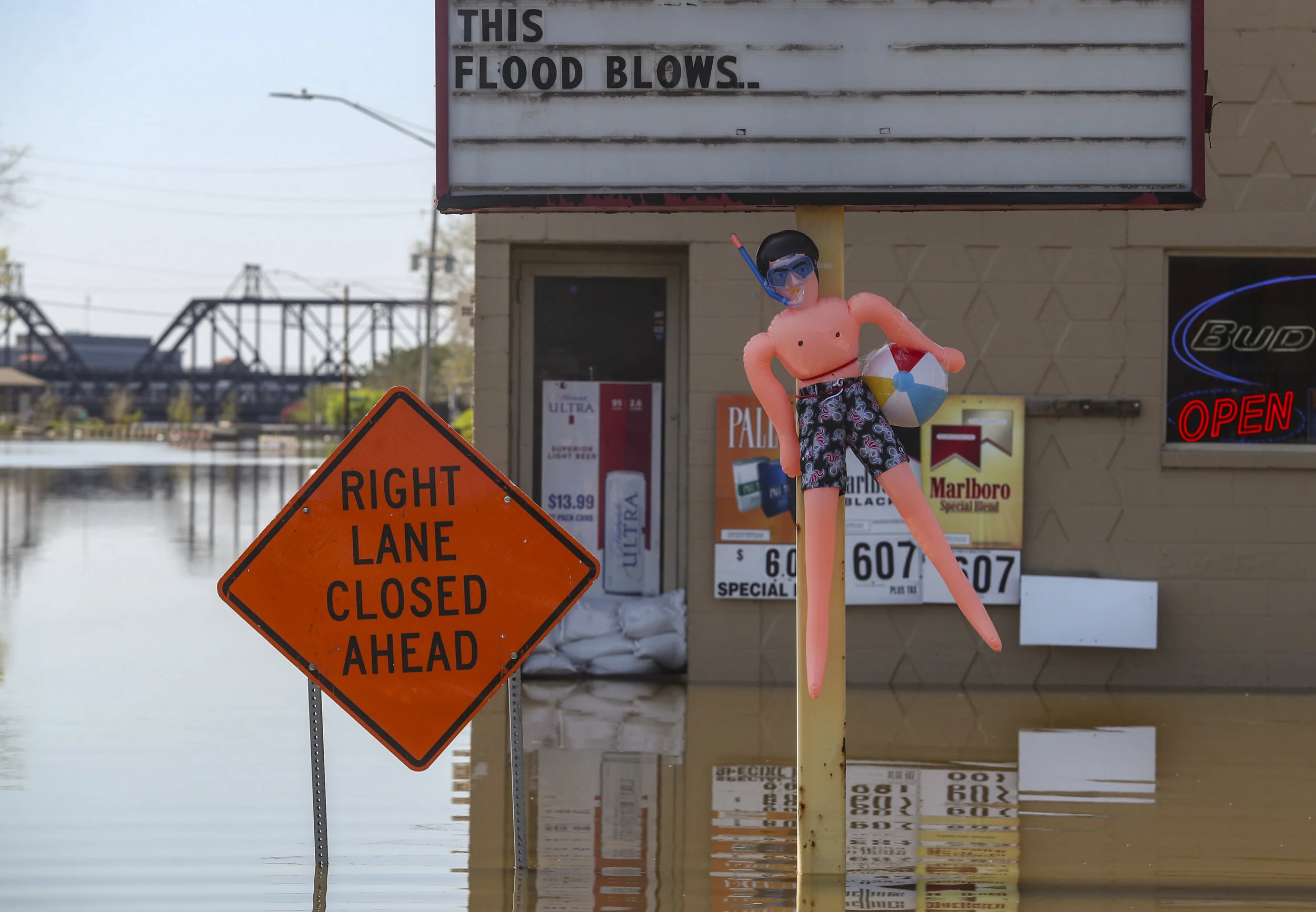 A sign at Java Java Cafe in Davenport gives comment on the record-breaking flooding throughout downtown, Saturday, May 4, 2019.