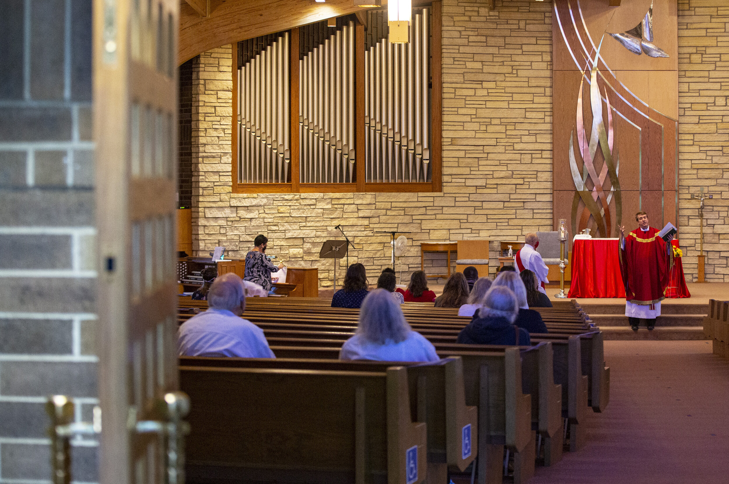  Rev. Mark Murphy begins mass at St. Jude’s Catholic Church in Cedar Rapids on Sunday.  