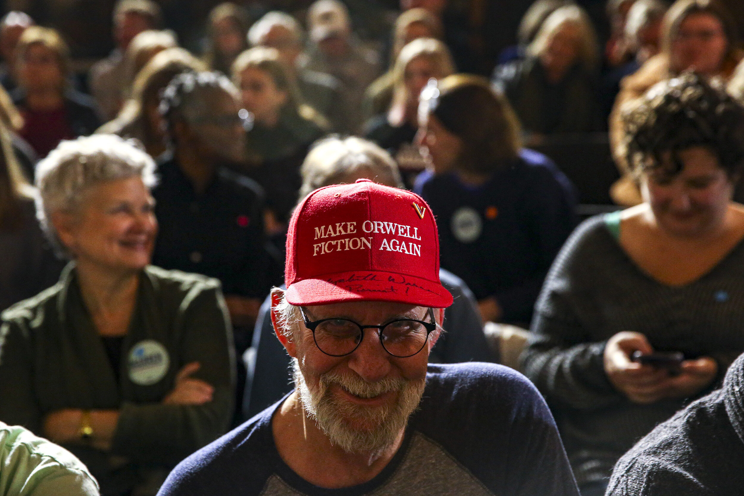  Pieter Breitner of Coralville sits in the front row while waiting to hear Sen. Elizabeth Warren speak during a town hall at the Iowa Memorial Union in Iowa City, Iowa, Monday.  