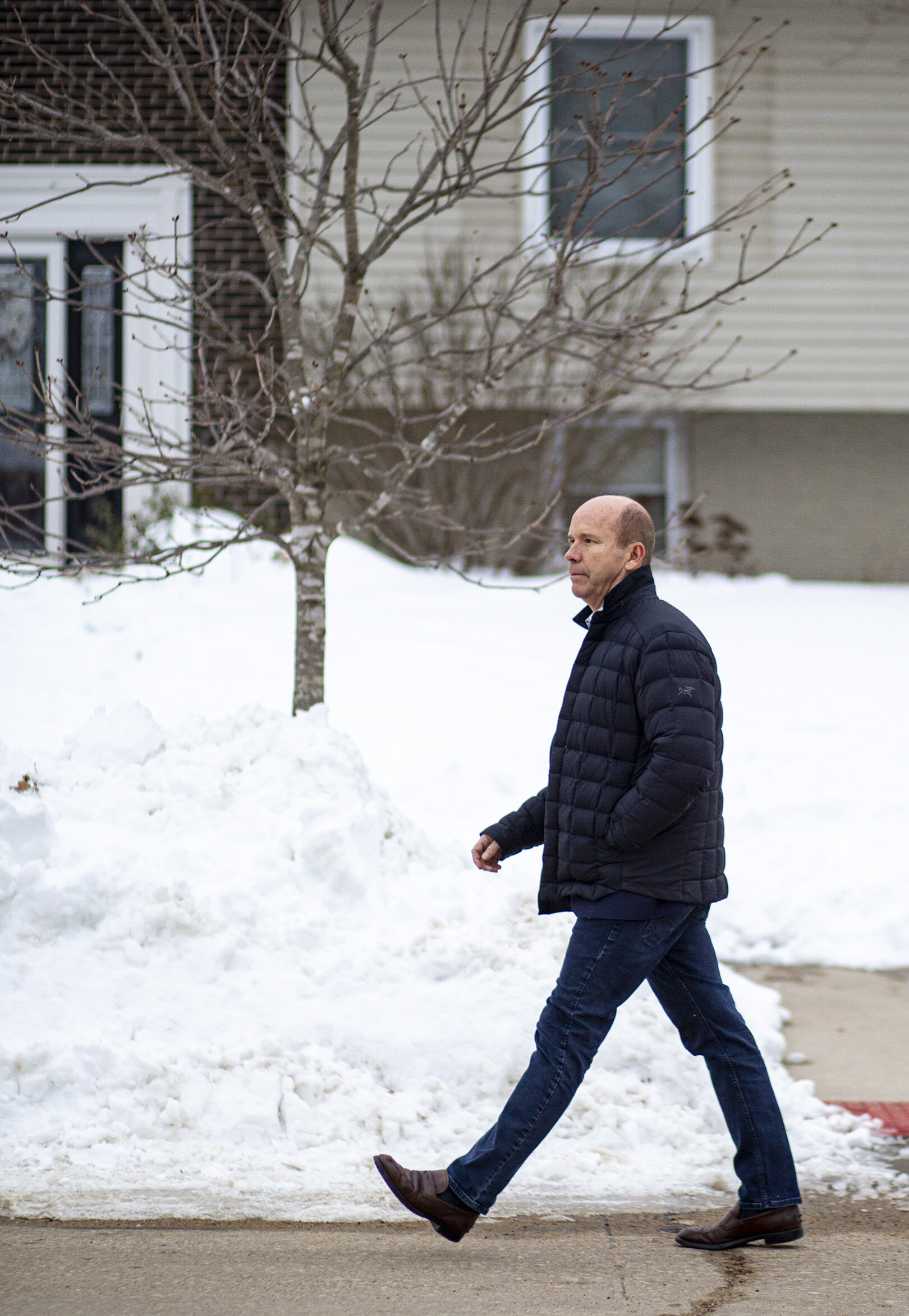  Democratic presidential candidate former U.S. Rep. John Delaney walks along Windsor Drive NE to knock on doors in Cedar Rapids, Iowa, Thursday. While walking down the street someone in the neighborhood yelled, “Trump 2020,” from afar to the candidat