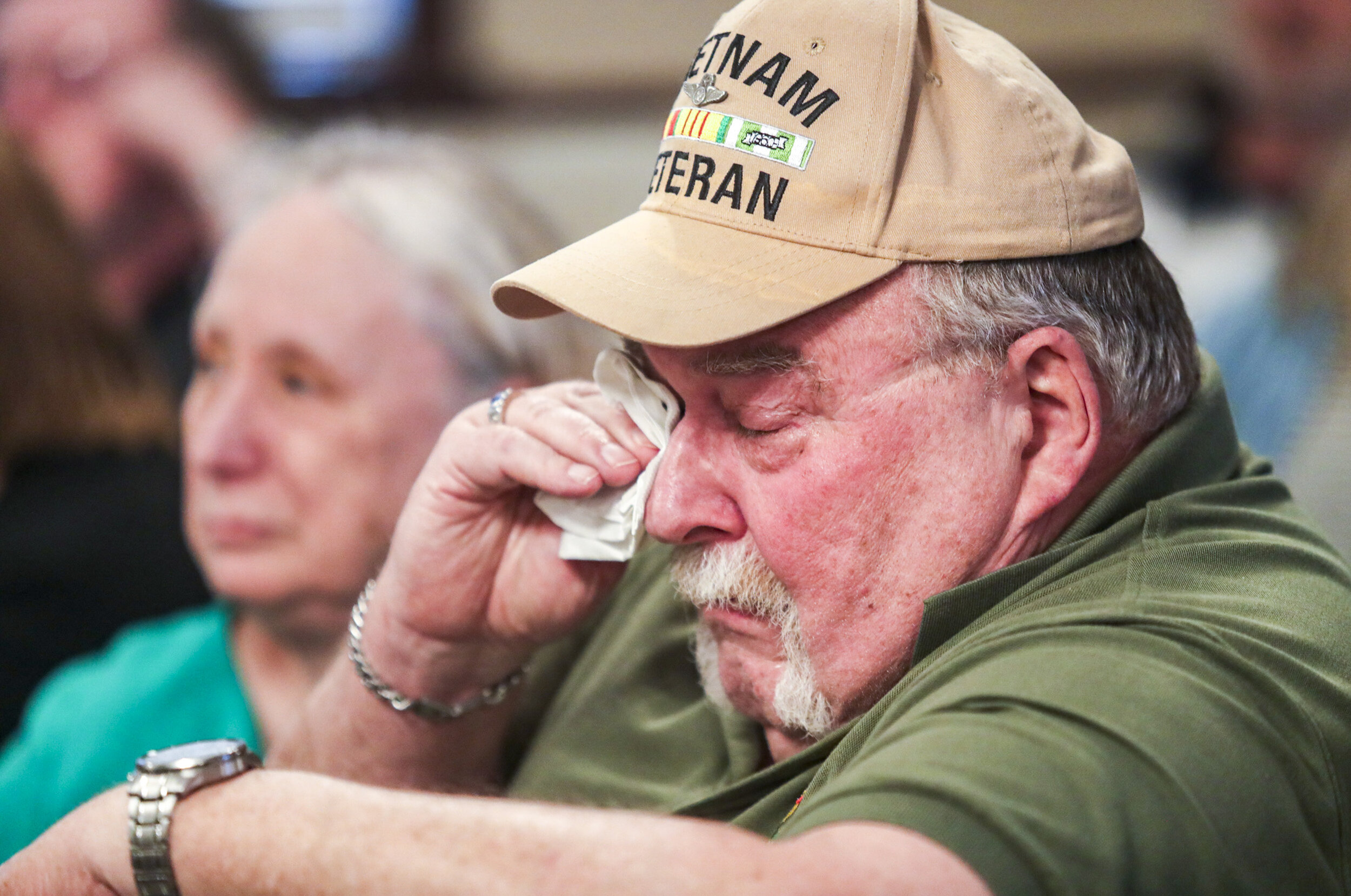  Vietnam veteran Mike Martin of Davenport wipes a tear from his eye as Sen. Amy Klobuchar speaks about her experiences working with the late Sen. John McCain during a meet and greet at Hickory Garden Family Restaurant in Davenport, Iowa, Sunday. 