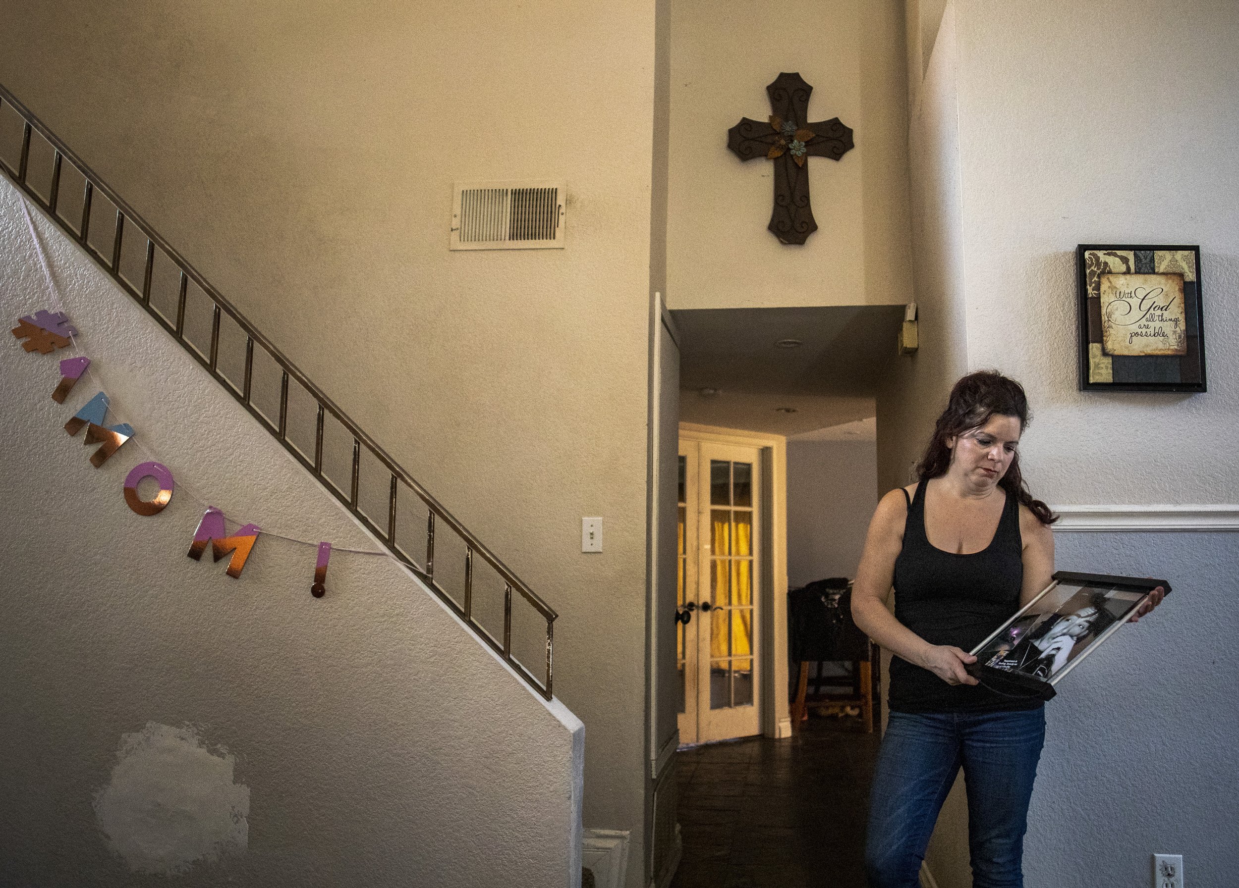  Kathy Nigro poses with a photo of her son, Michael Vasquez, at her home in Menifee, Calif., Wednesday. Vasquez died in jail on May 26 of 2022 in the custody of the Riverside County Sheriff’s Department. 
