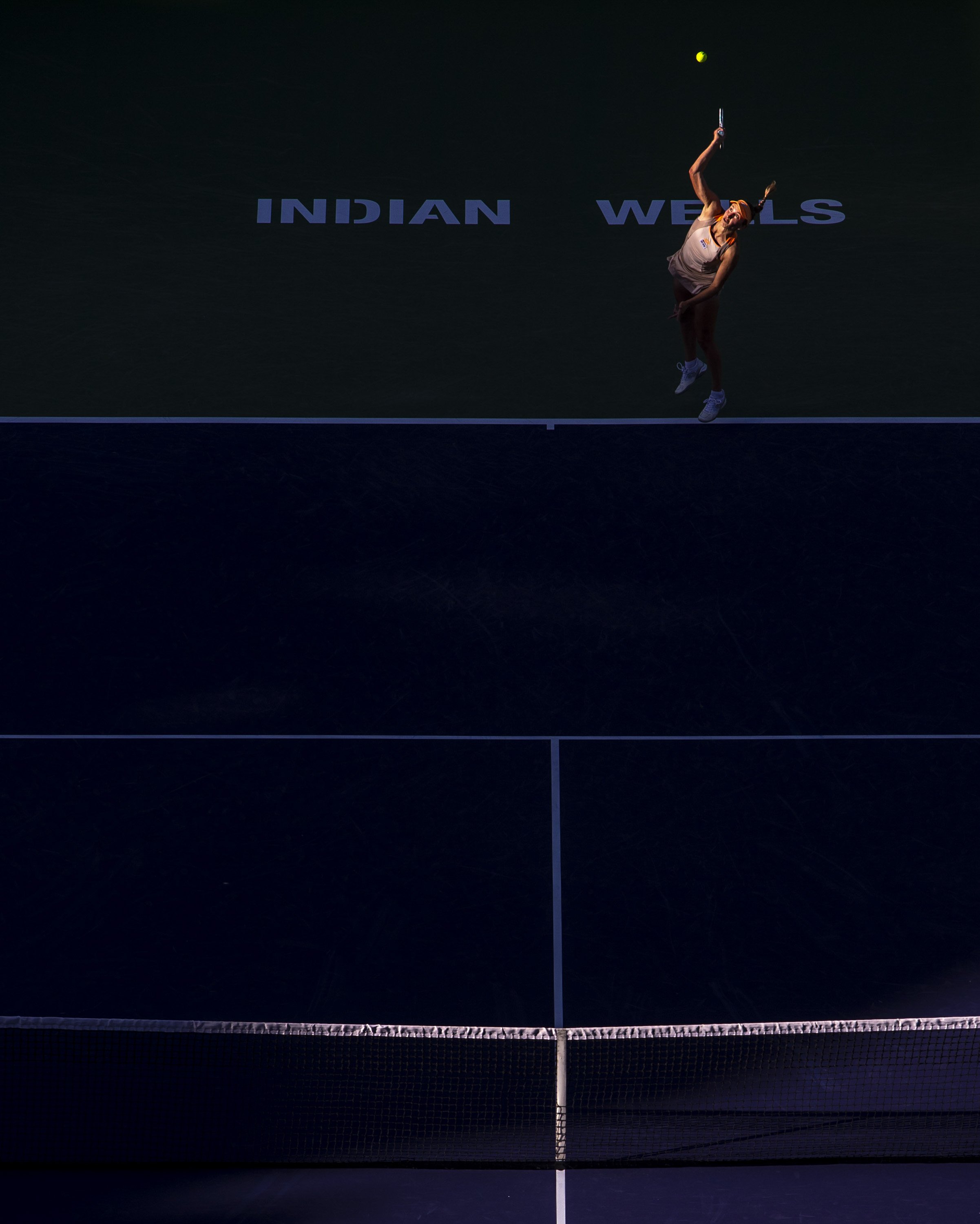 Elise Mertens serves to Naomi Osaka during round three at the BNP Paribas Open in Indian Wells, Calif., Monday.
