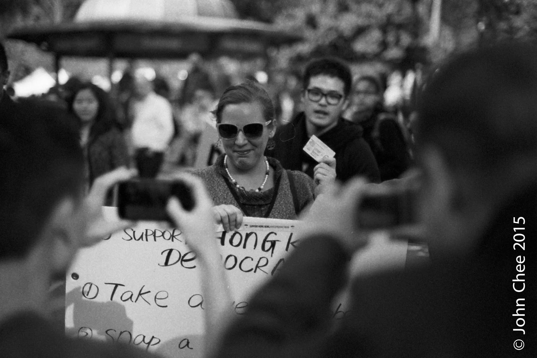 New Yorkers (waving her Hong Kong ID card) showing solidarity with the Umbrella Movement #3 (Union Square, Manhattan, New York)