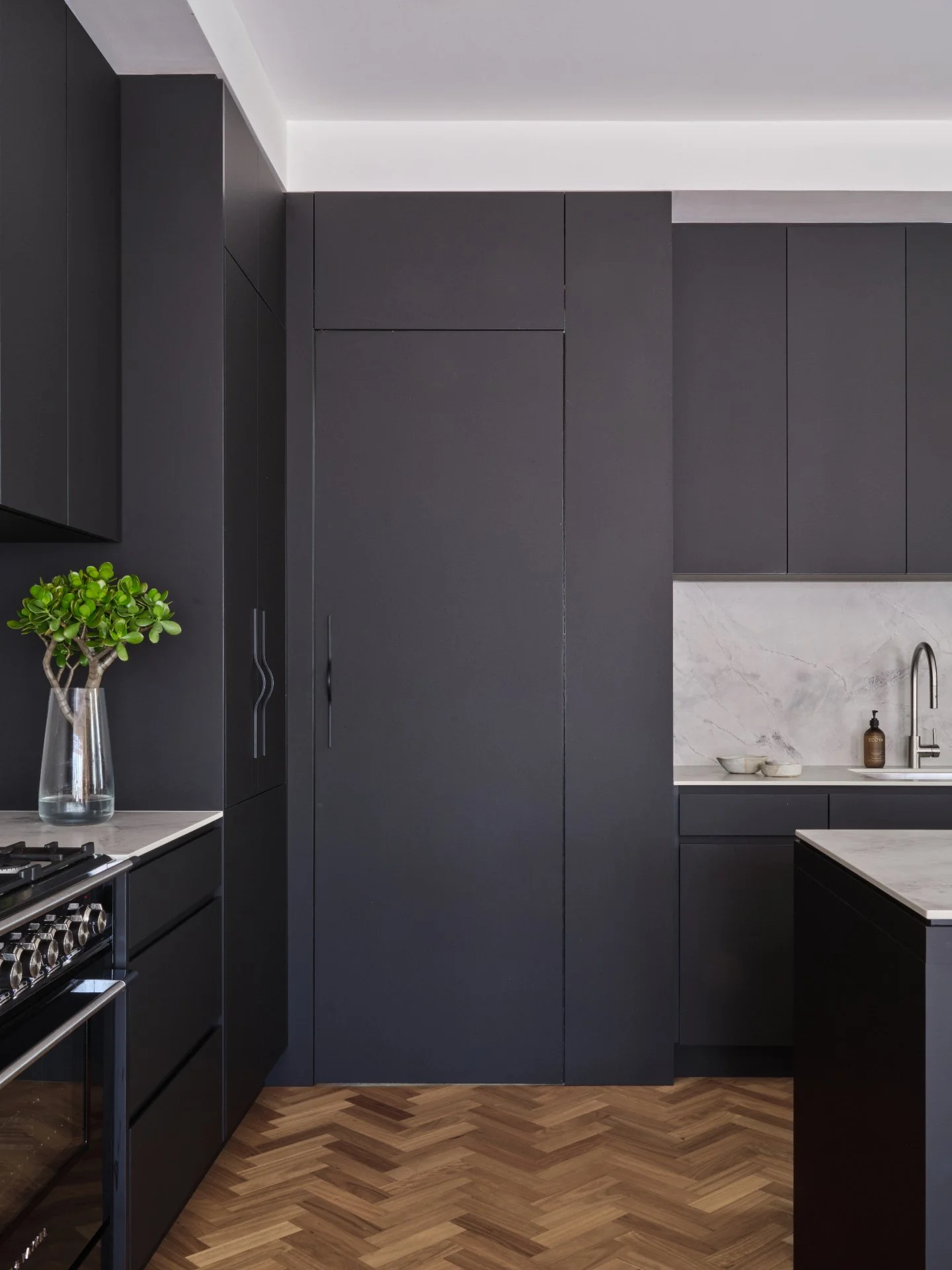 Not everything is as it seems...

In our Randwick project, this bold, dark kitchen makes a strong first impression. The rich timber parquet floors bring warmth and texture to balance the palette. But look a little closer. What appears to be a simple 