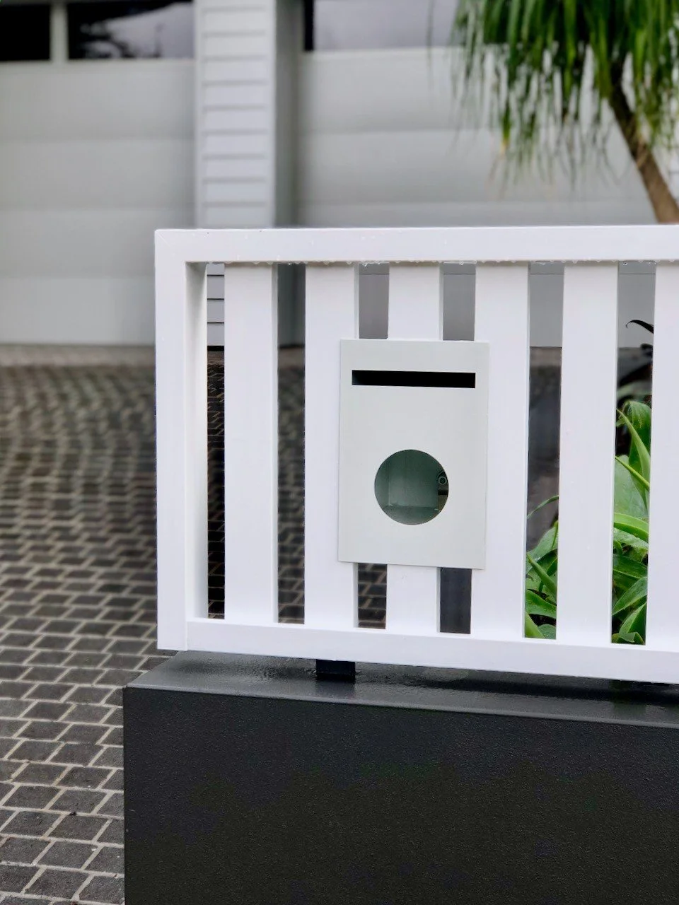 Letterbox and fence detail from our Freshwater project. For good street appeal, make sure your fence colours tie in with the house. And don&rsquo;t be afraid of a bit of contrast. Dark colours make lighter ones feel so fresh!