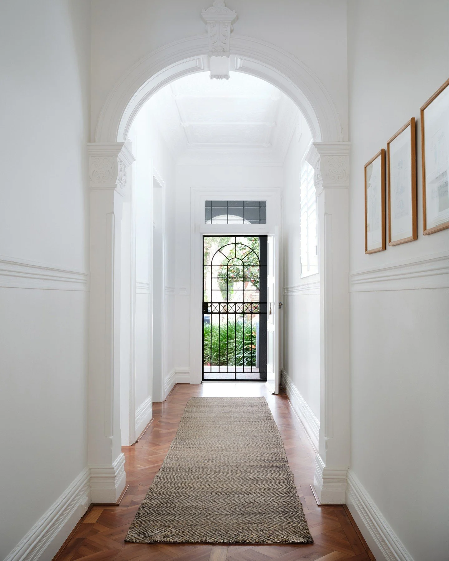 Blending old + new in your home

Our Randwick project shows how a classic period home can flow seamlessly into a modern open-plan space. We kept the ornate hallway (because look at those arches!) and tied it all together with parquetry floors running