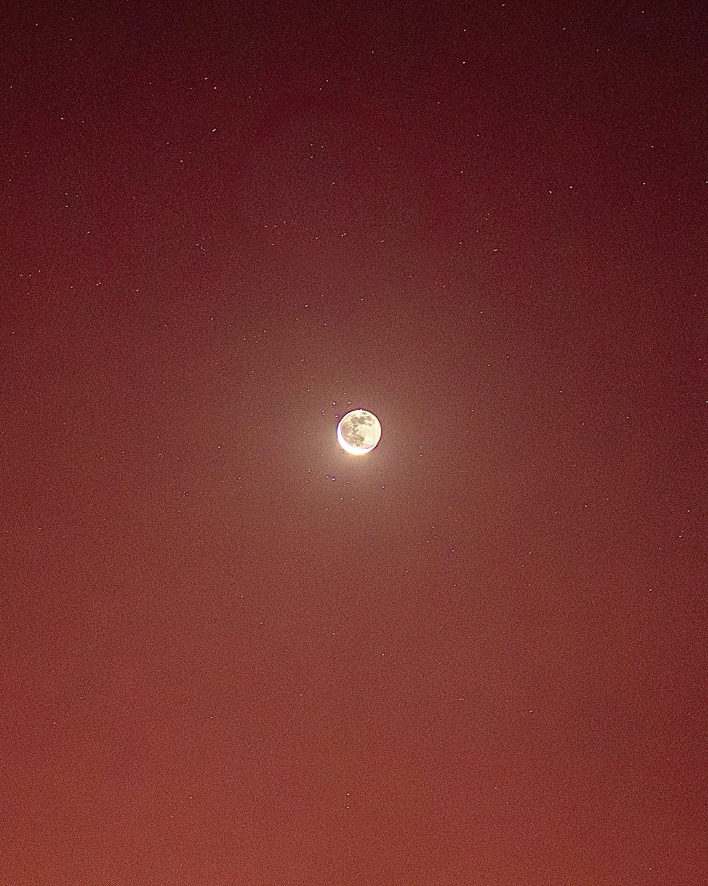 The crescent moon rising over Mount Sinai during dawn.