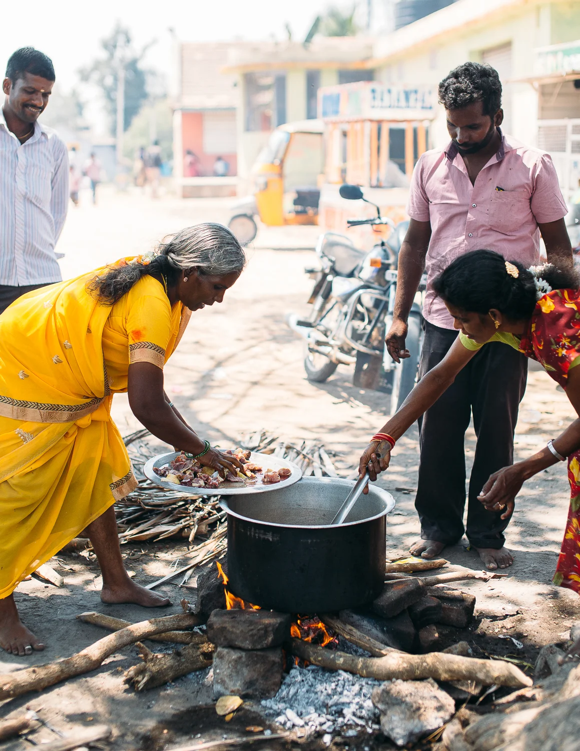 Families prepare meals in Vettuvanam, India on March 11, 2016.