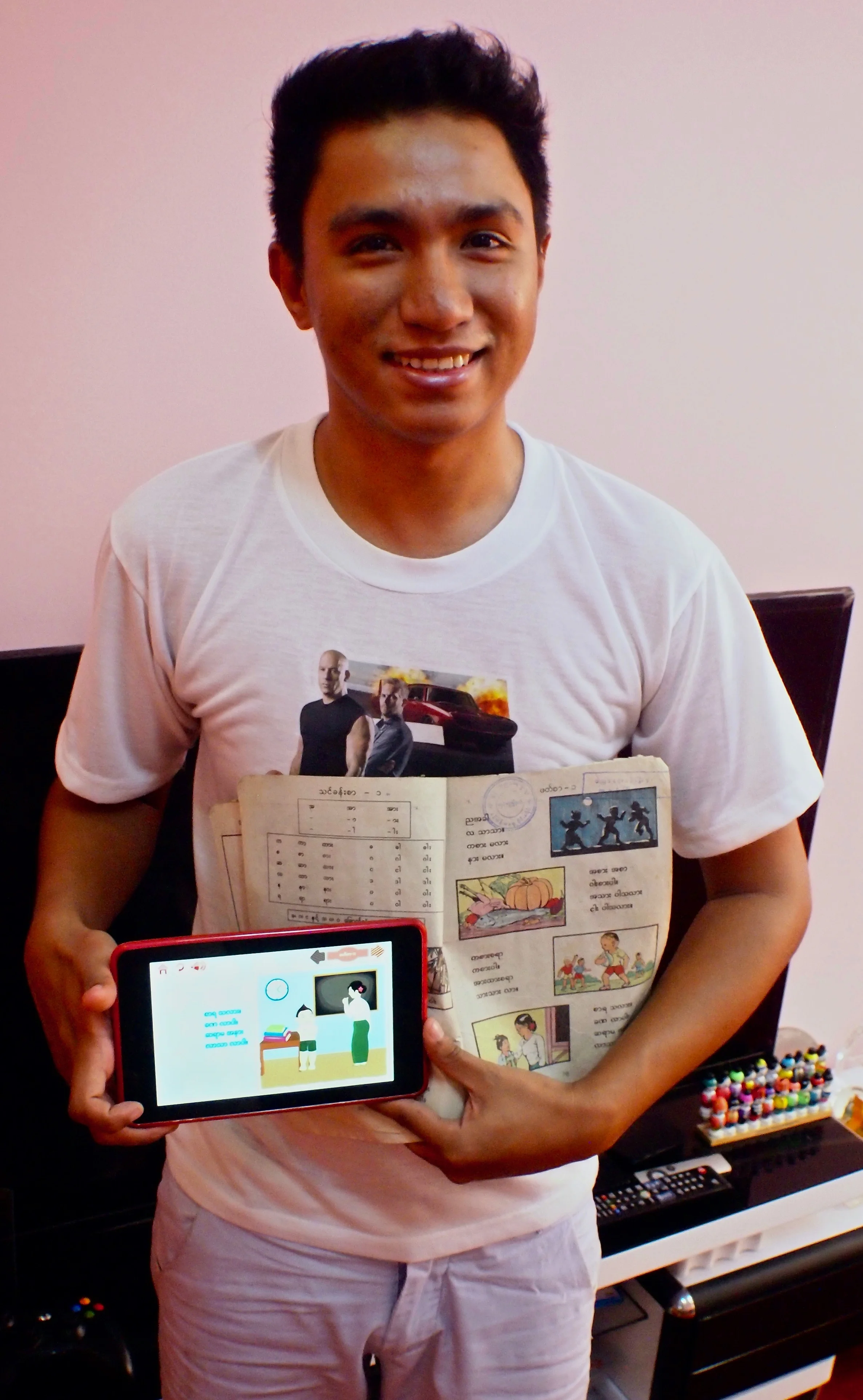 Thet Naing Swe builds educational apps based on traditional school books for working Birmese children. (C) Remko Tanis