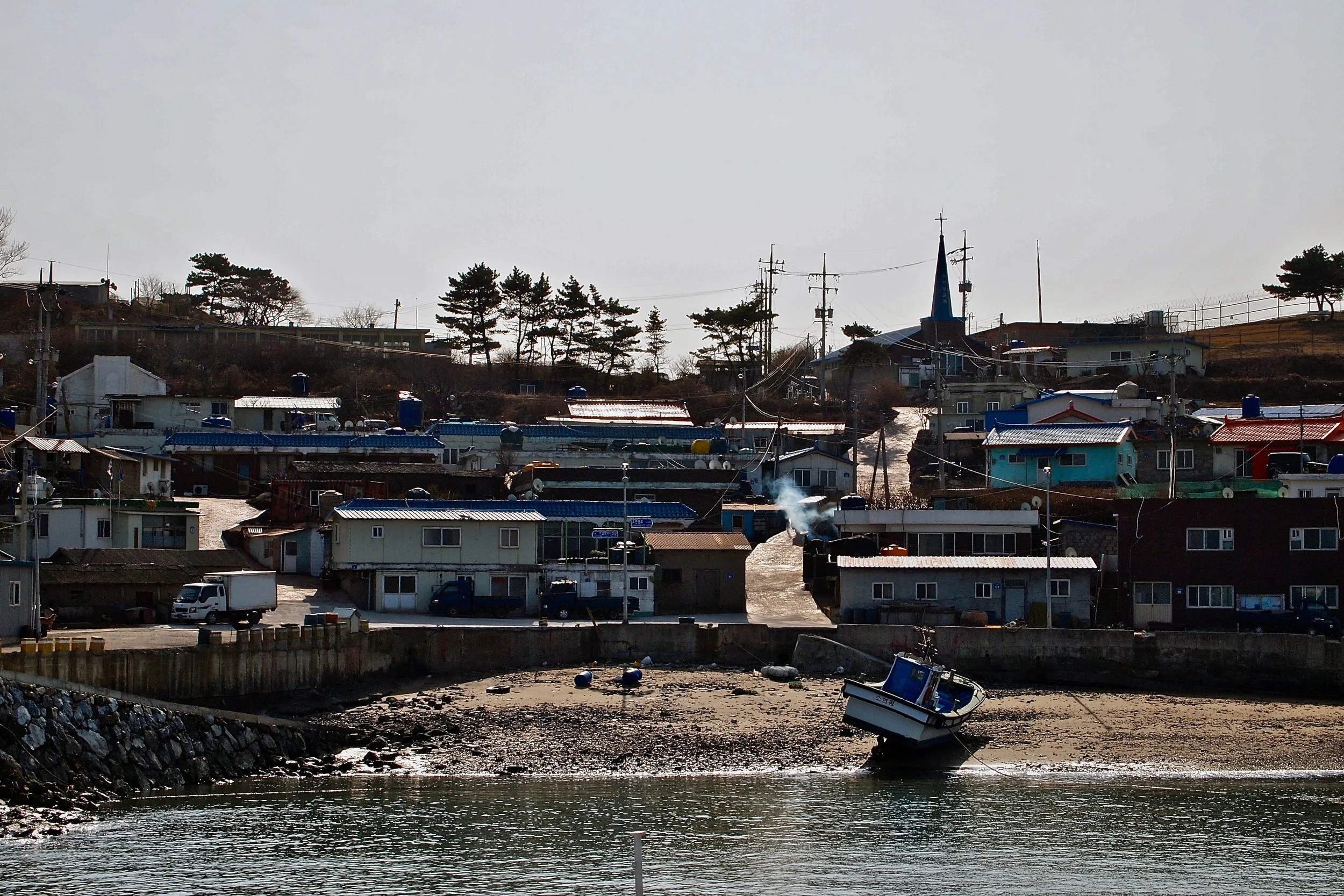 South Korea evacuated the 1400 residents of Yeonpyeong Island after it was hit by shelling from North Korea, killing four people. (C) Remko Tanis