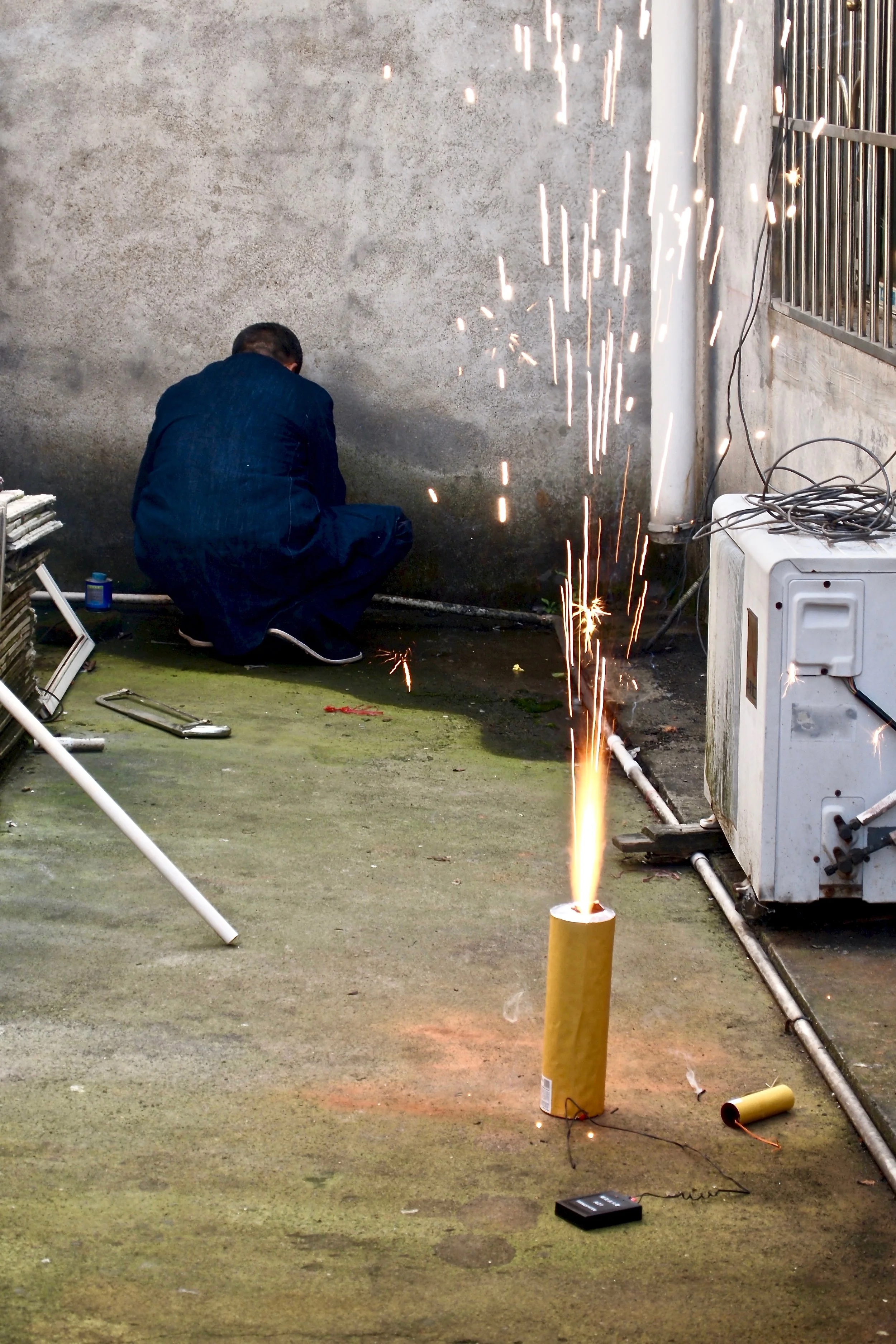 An employee testing fireworks at Dream Fireworks factory in Liuyang, China. Photo: (C) Remko Tanis