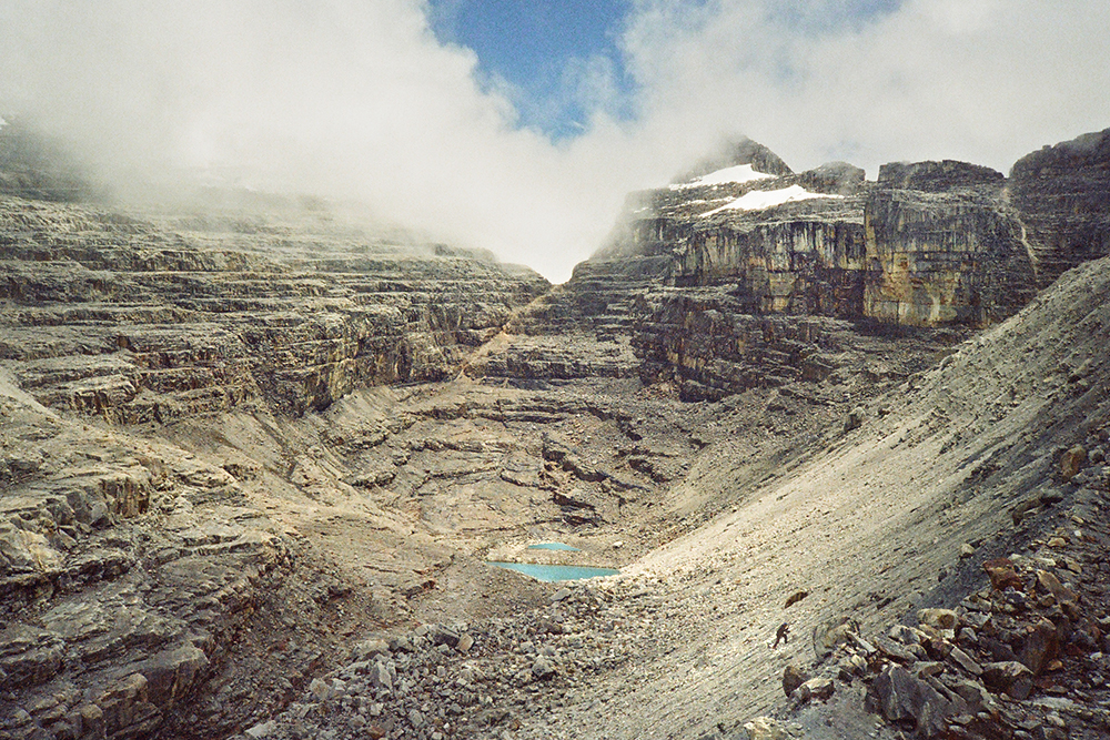 After getting rained on and scrambling up an embankment in Chorro Aguabendita , the clouds cleared and two bright blue, glacially fed alpine lakes came into view. 