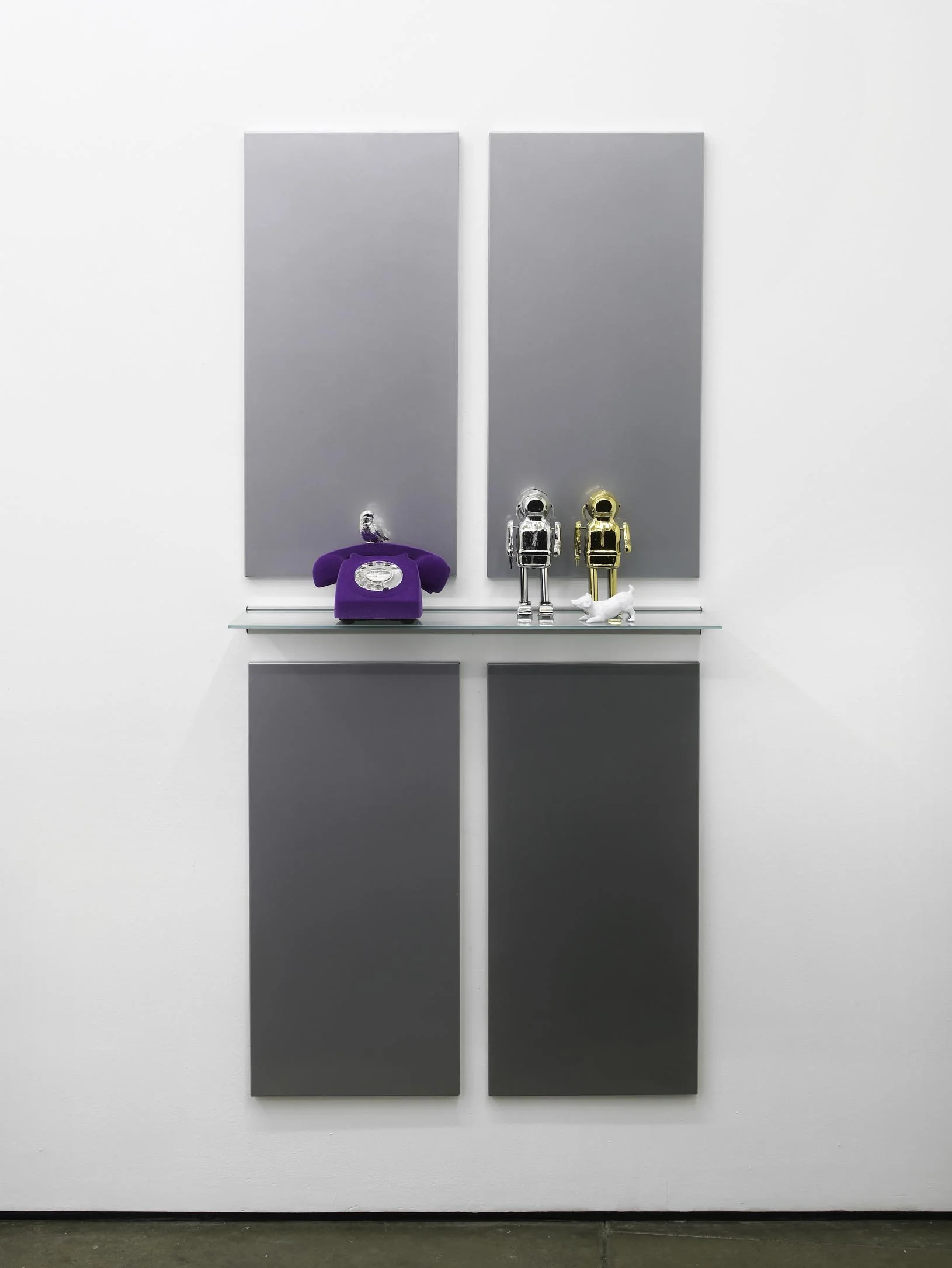 Matthew Darbyshire Untitled Homeware No. 12 2011 Chromed silver and gold toy robots, purple flocked telephone, painted white Beswick dog ornament, glass and steel support: 172 x 80 x 16.5 cm