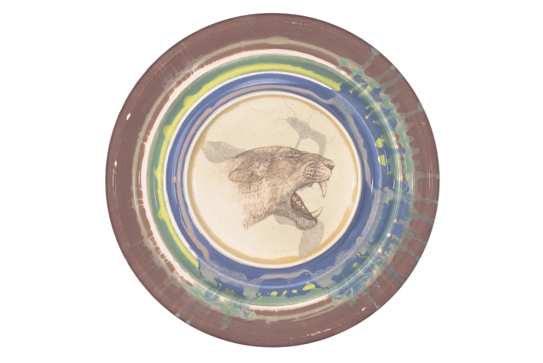 Cave lion 2002 slip decorated earthenware with photoceramic transfer 22cm diameter x 2 cm