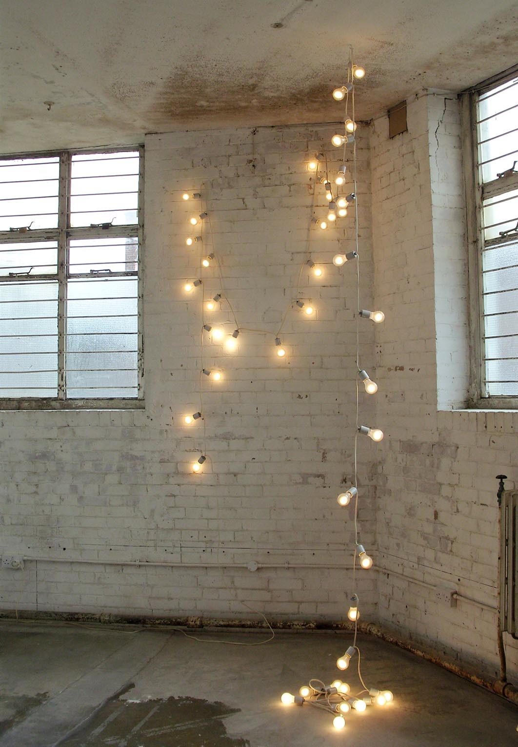      Felix Gonzalez-Torres   "Untitled" (America) #2   1992   42 Light Bulbs, Extension Cords, Porcelain Light Sockets:&nbsp;  Installation Variable  