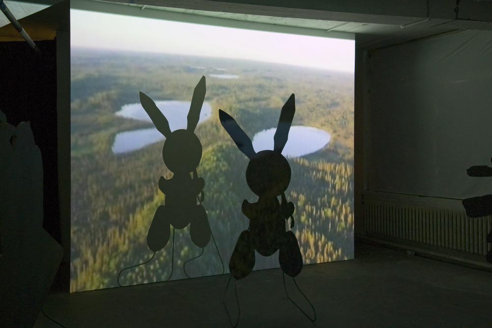     Around, About Expanded Field Sculpture Silhouette Props:&nbsp;(J. Koons 'Rabbit' 1986) 2007 Projection, MDF, Paint, Steel stands    