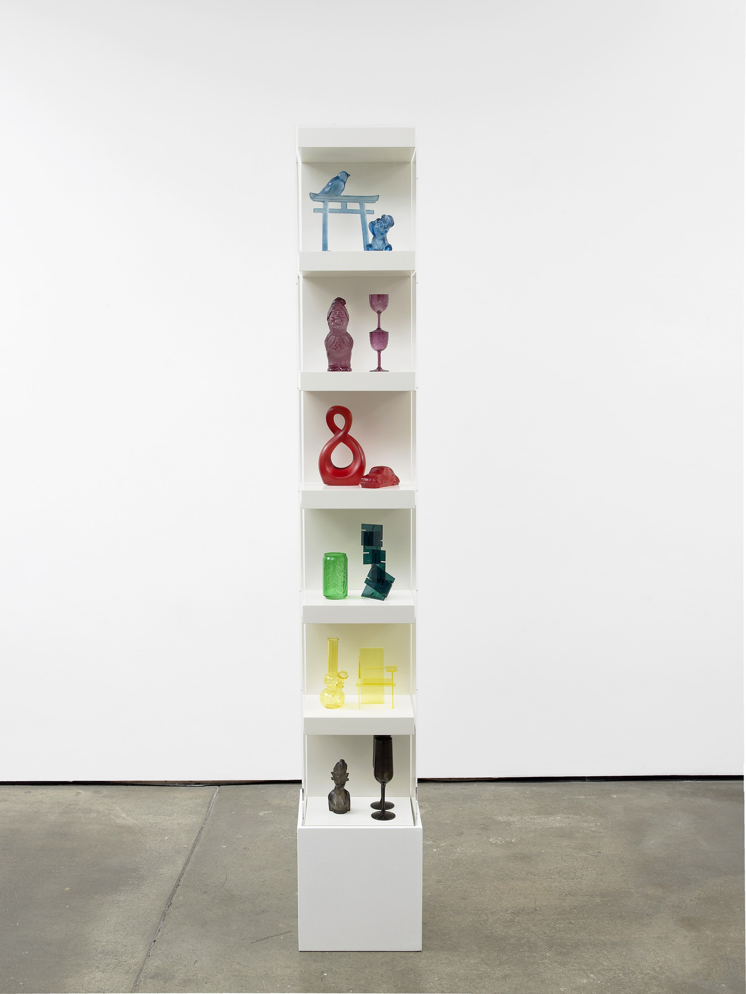     Matthew Darbyshire Untitled: Accessorised Column No. 5 2012 Plastic, glass, and resin components, shelving units, and perspex case 215 x 30 x 30 cm    