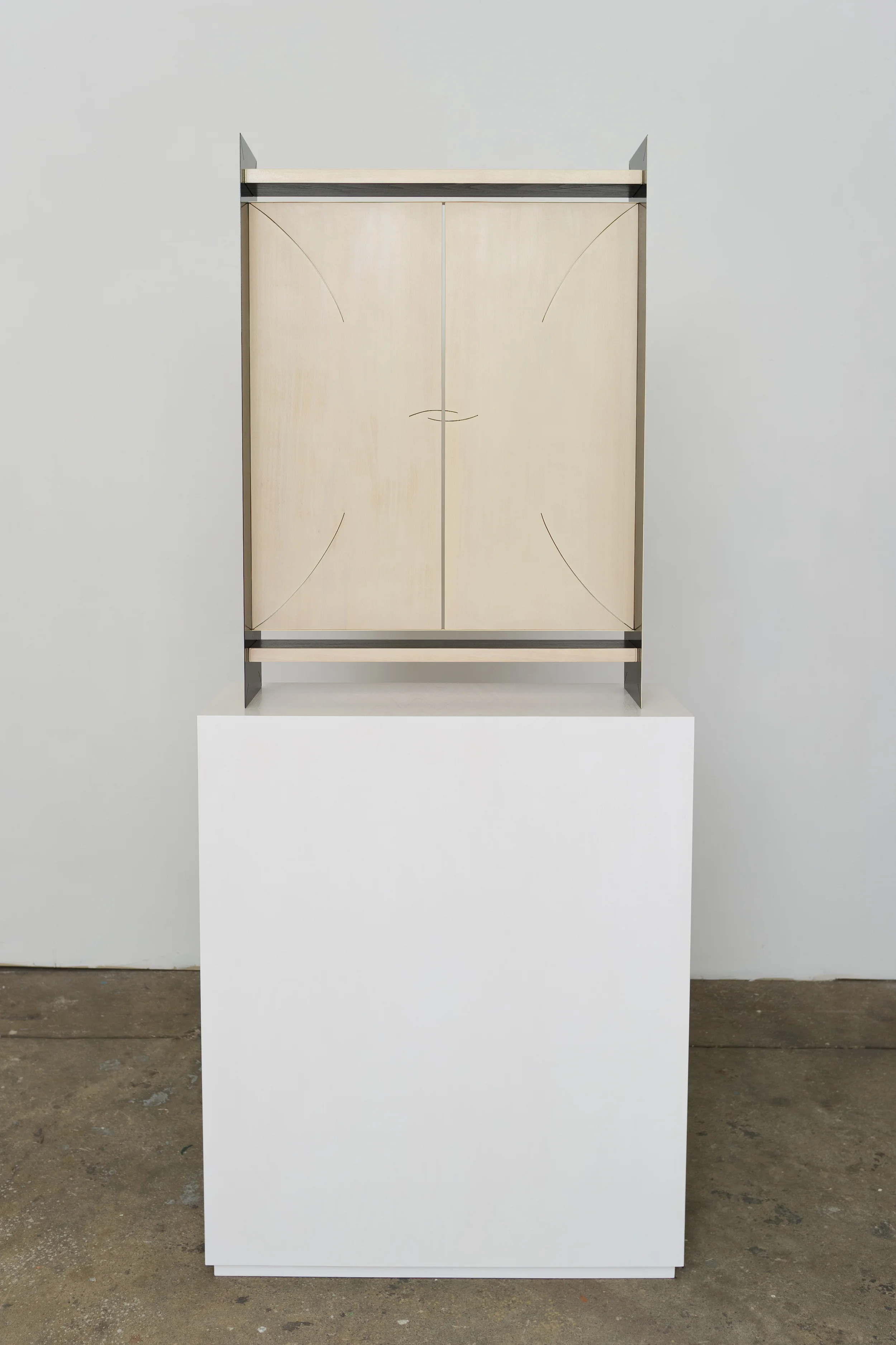 Split Plaque (Black/Cream) 2014 Euro-Beech hardwood, steel, copper rivets, enamel, wax 88.9 x 62.2 x 17.7 cm / 35 x 24.5 x 7 in Plinth: 91.4 x 76.2 x 27.9 cm / 36 x 30 x 11 in