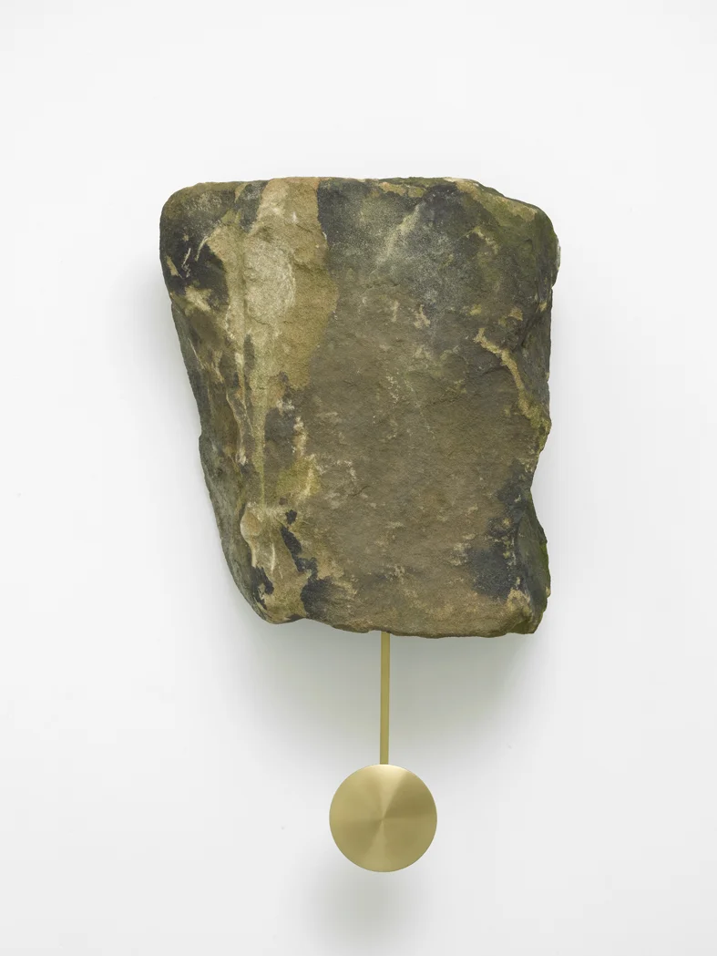 Klaus Weber Clock Rock 2015 Yorkstone rock, brass pendulum, clock movement 57 x 52 x 27 cm / 22.4 x 20.5 x 10.6 in (stone) 88.5 x 52 x 27cm / 33.7 x 20.5 x 10.6 in (with pendulum)