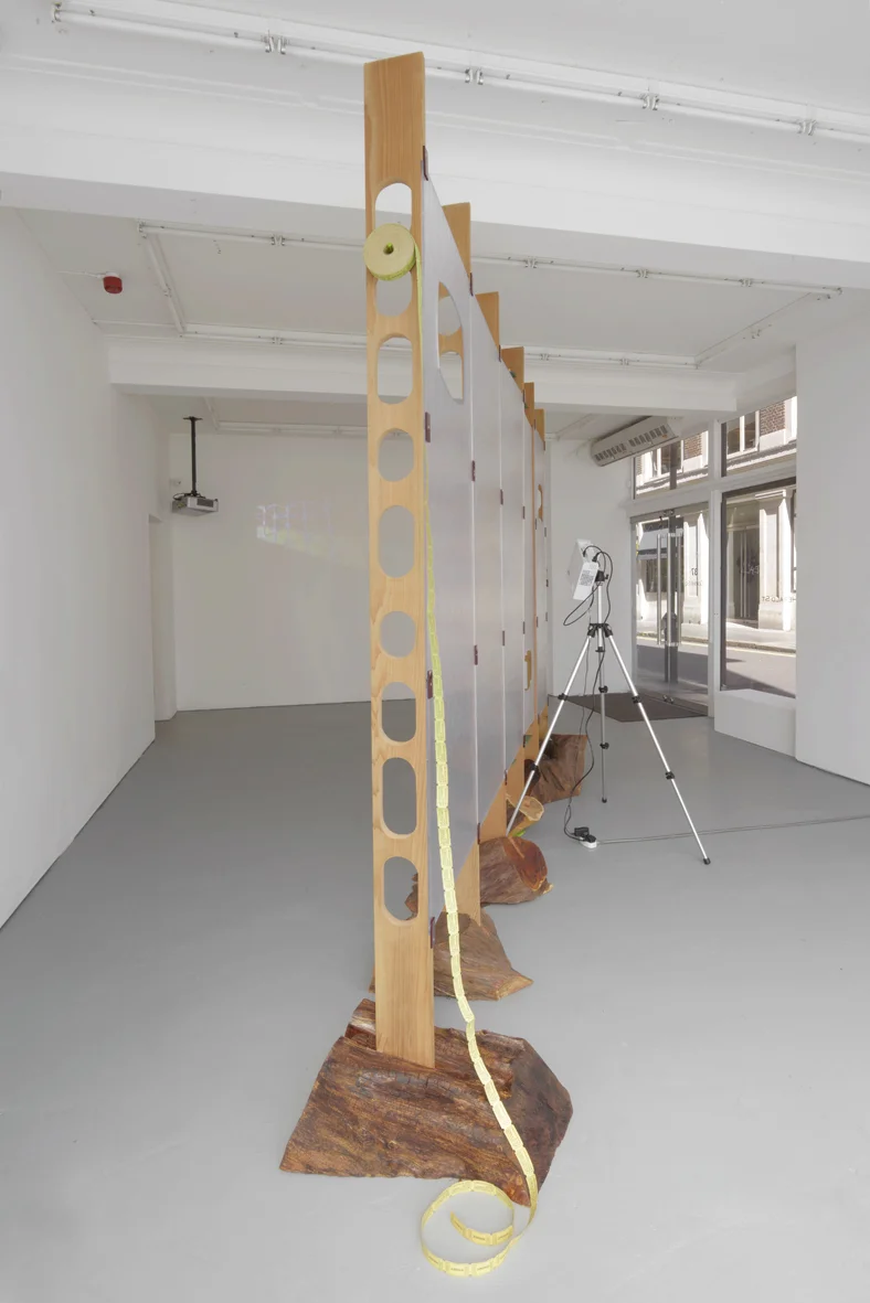Refreshment 2005 Cedar wood, yew wood, perspex, dvd loop, silver projection screen, ticket roll, stainless steel screws, painted nails Dimensions variable, approx 261 x 360 cm l / 102.8 x 141.7 in