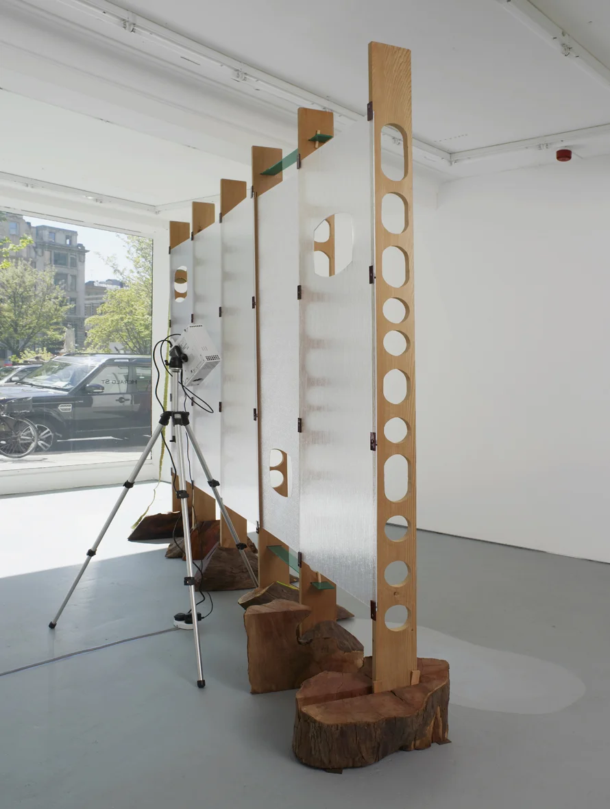 Refreshment 2005 Cedar wood, yew wood, perspex, dvd loop, silver projection screen, ticket roll, stainless steel screws, painted nails Dimensions variable, approx 261 x 360 cm l / 102.8 x 141.7 in