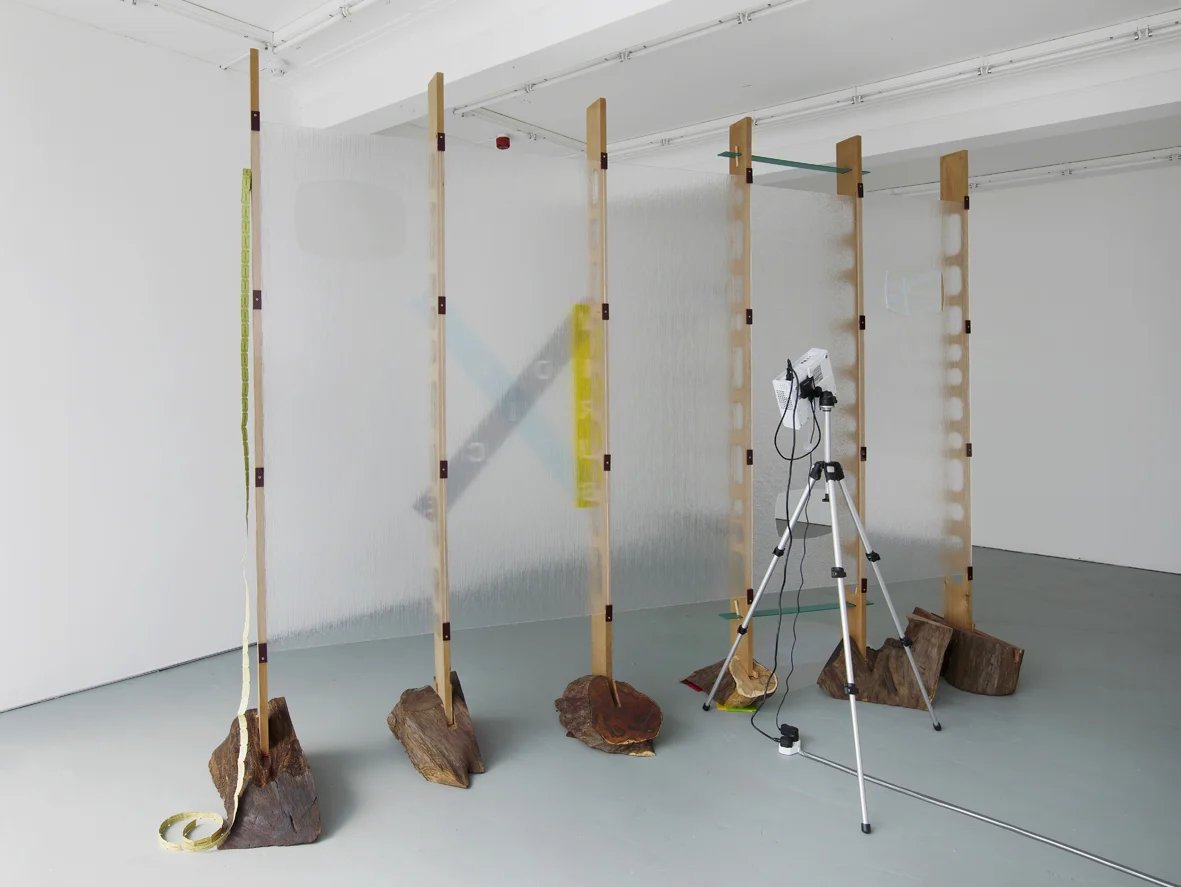 Refreshment 2005 Cedar wood, yew wood, perspex, dvd loop, silver projection screen, ticket roll, stainless steel screws, painted nails Dimensions variable, approx 261 x 360 cm l / 102.8 x 141.7 in