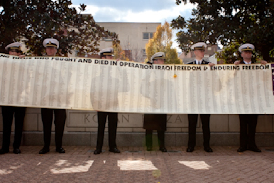 GW veterans hold a banner featuring the names of the more than 2,000 soldiers who died during Operation Iraqi Freedom. The banner was given to the GW Vets student organization at George Washington’s Veterans Day Ceremony on Friday.