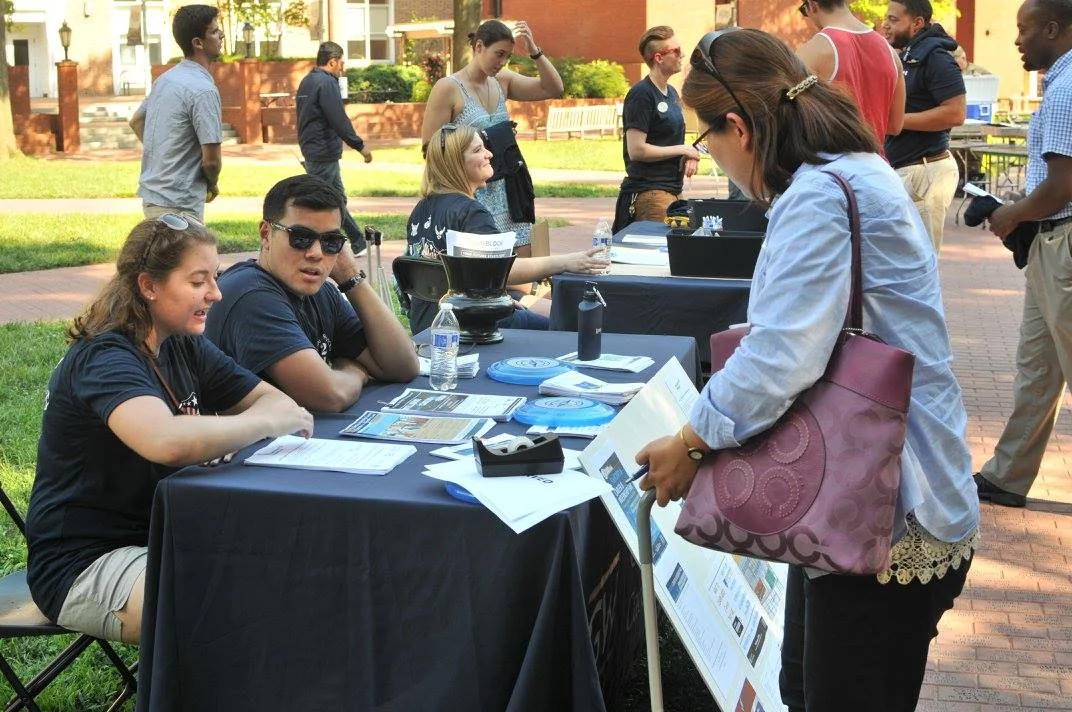 GW Veterans Bryan la Madrid and Jessica Crist at the GW VALOR Tailgate representing GW VALOR Career Services and GW Study Abroad respectively.