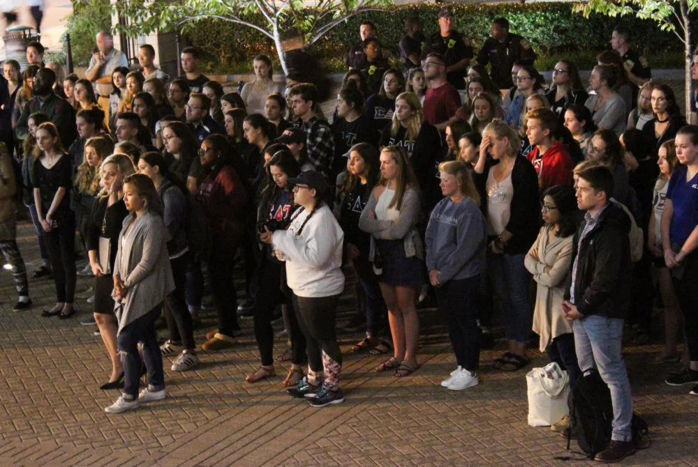 MEDIA CREDIT: DEREK LONG | STAFF PHOTOGRAPHER A group of student organizations held a vigil to honor 9/11 first responders in Kogan Plaza Monday night, the sixteenth anniversary of the terror attacks.