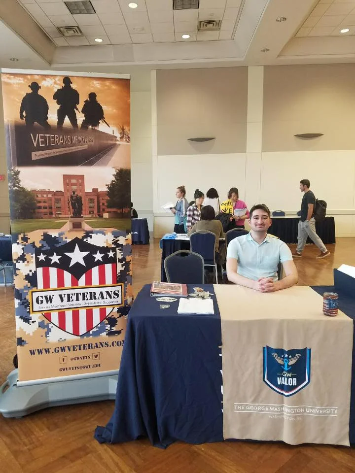 Fundraising Director Charlie Spirtos hosts a table at the incoming student services fair to discuss GW Veterans.
